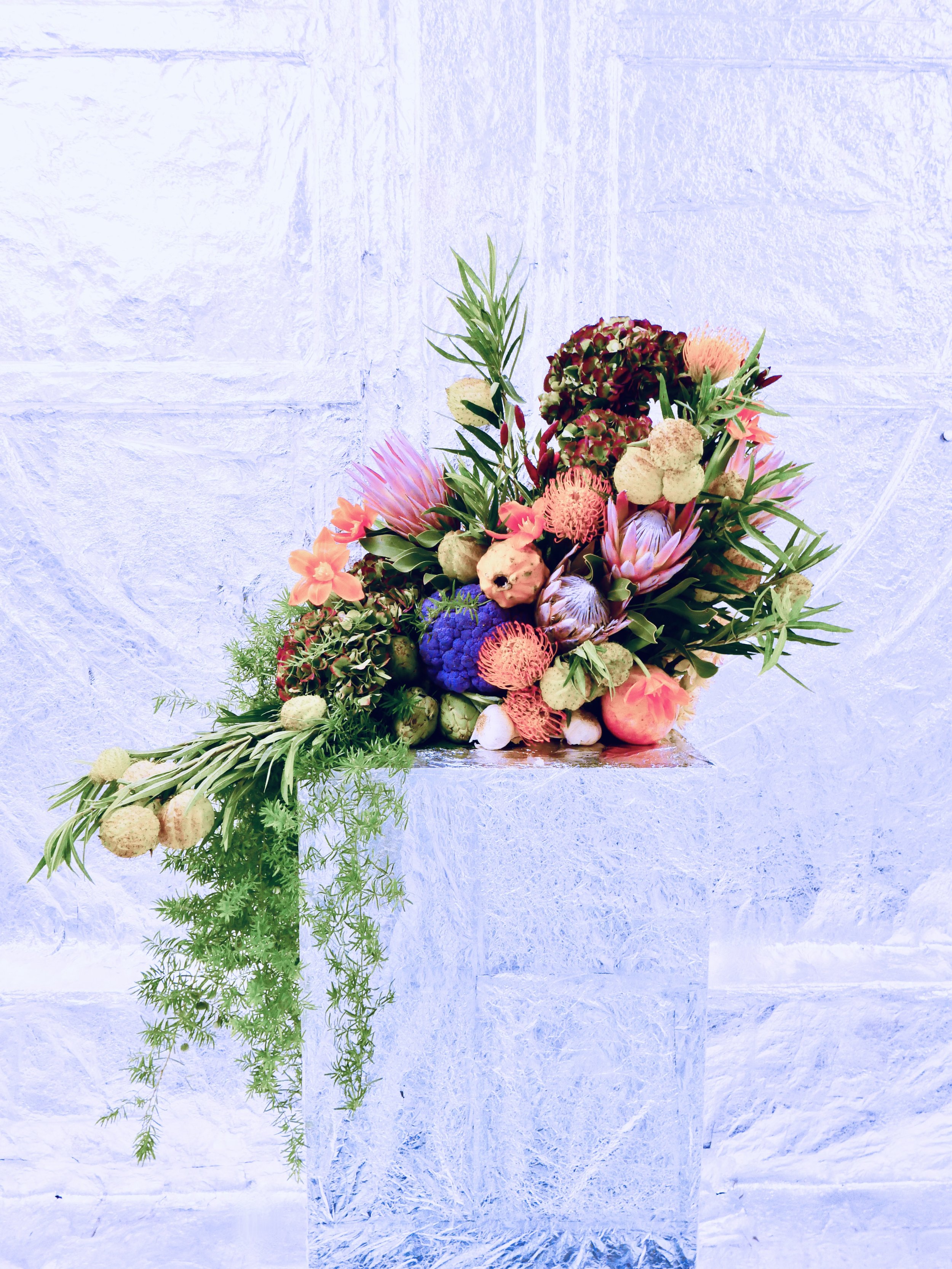 Colorful floral creation made with proteas and proteas.jpg