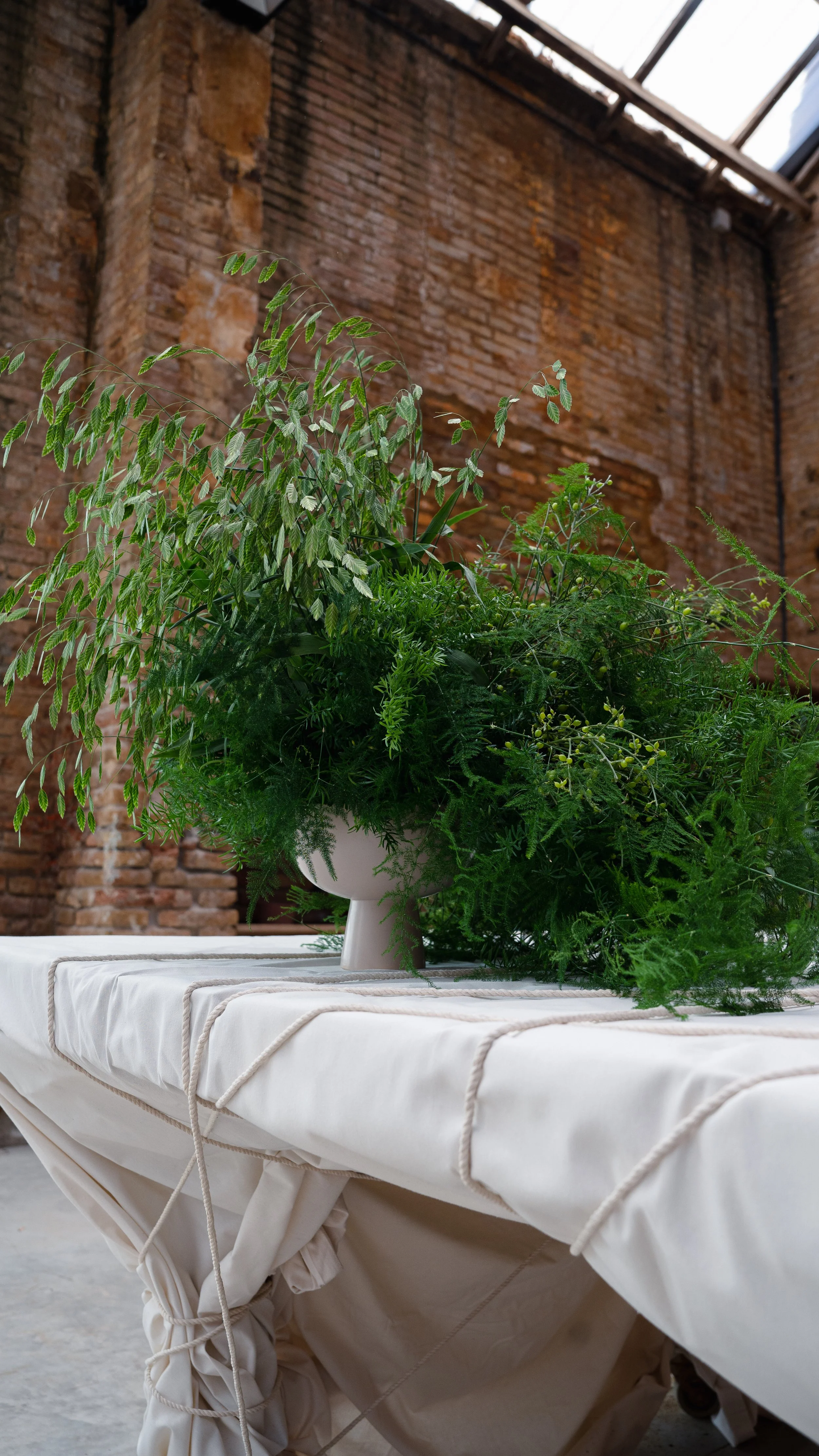 Guests attending the Pranarôm x HerbalGem luxury wellness event organized by A Point Agency at Flowers by Bornay, surrounded by bespoke foliage installations designed for an elegant brand experience