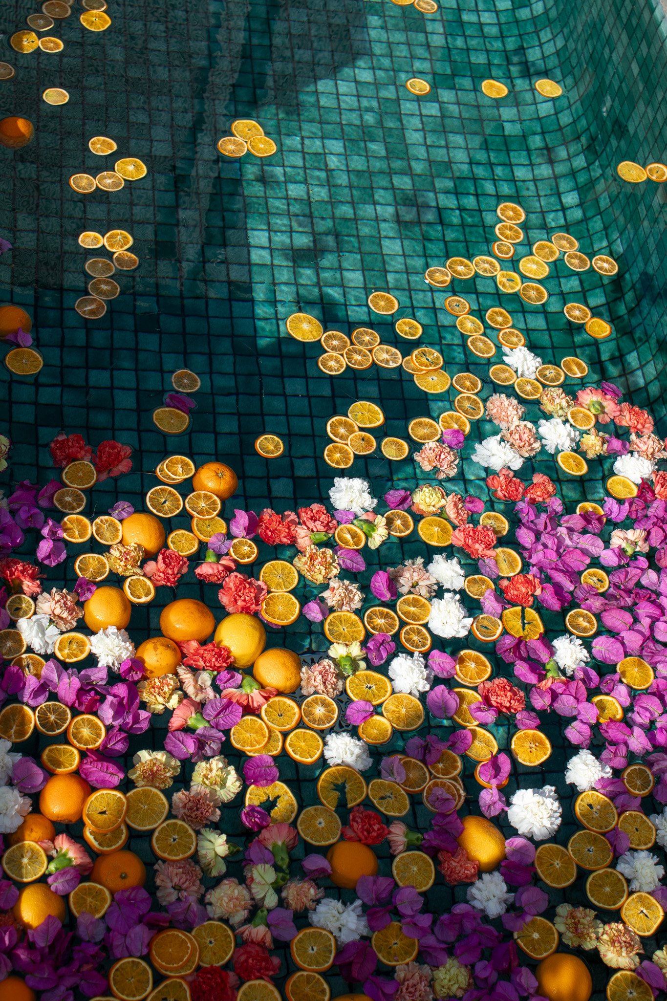 Colorful floral and citrus composition floating across the hotel’s pool.