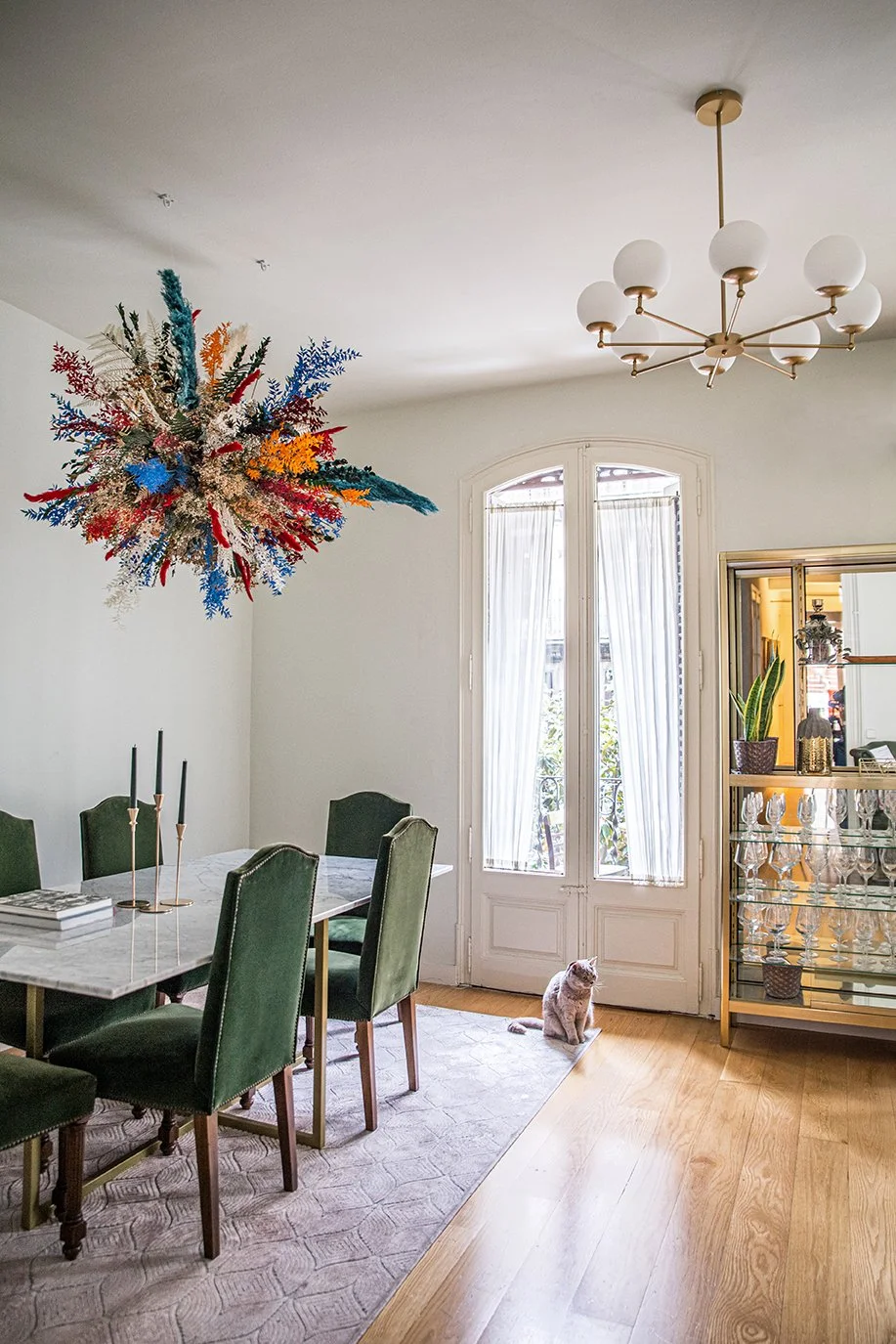 Dining room featuring bold floating floral artwork created for a private client in Barcelona