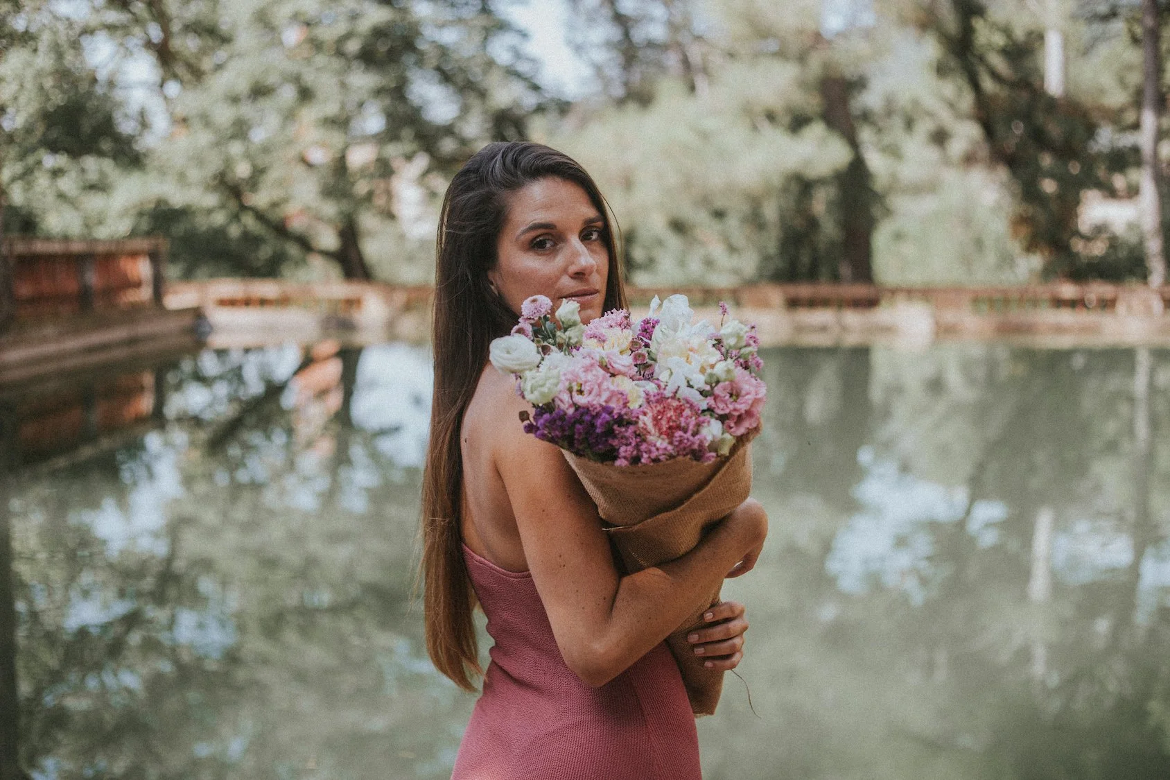 Model posing with bouquet by Mosaic Flowers in Horta park Barcelona, editorial floral design for international events