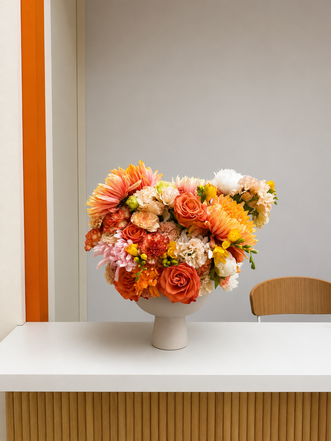Abundant handcrafted floral arrangement in warm seasonal tones, created by Mosaic Flowers for a luxury international brand event at the Cannes Lions Festival