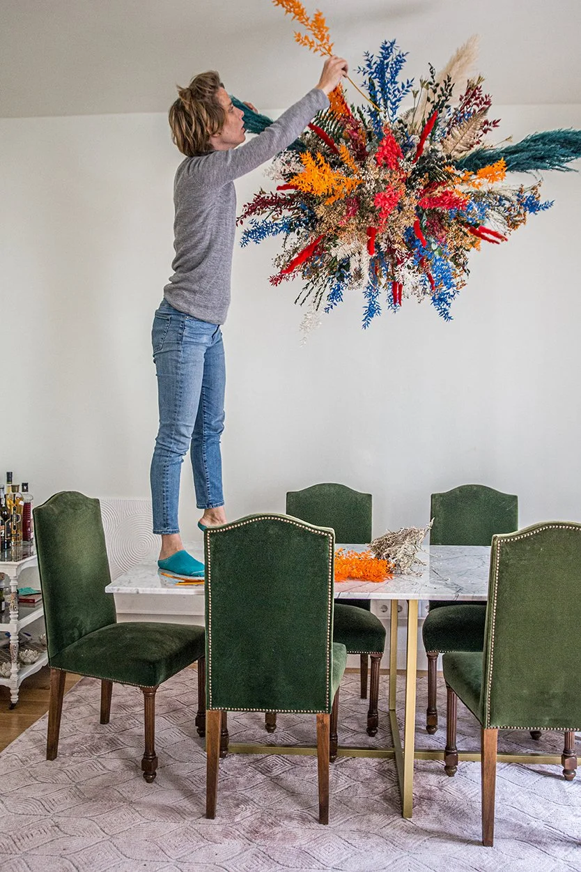 Floral artist Margaux creating sophisticated floating flower installation for private client in Barcelona