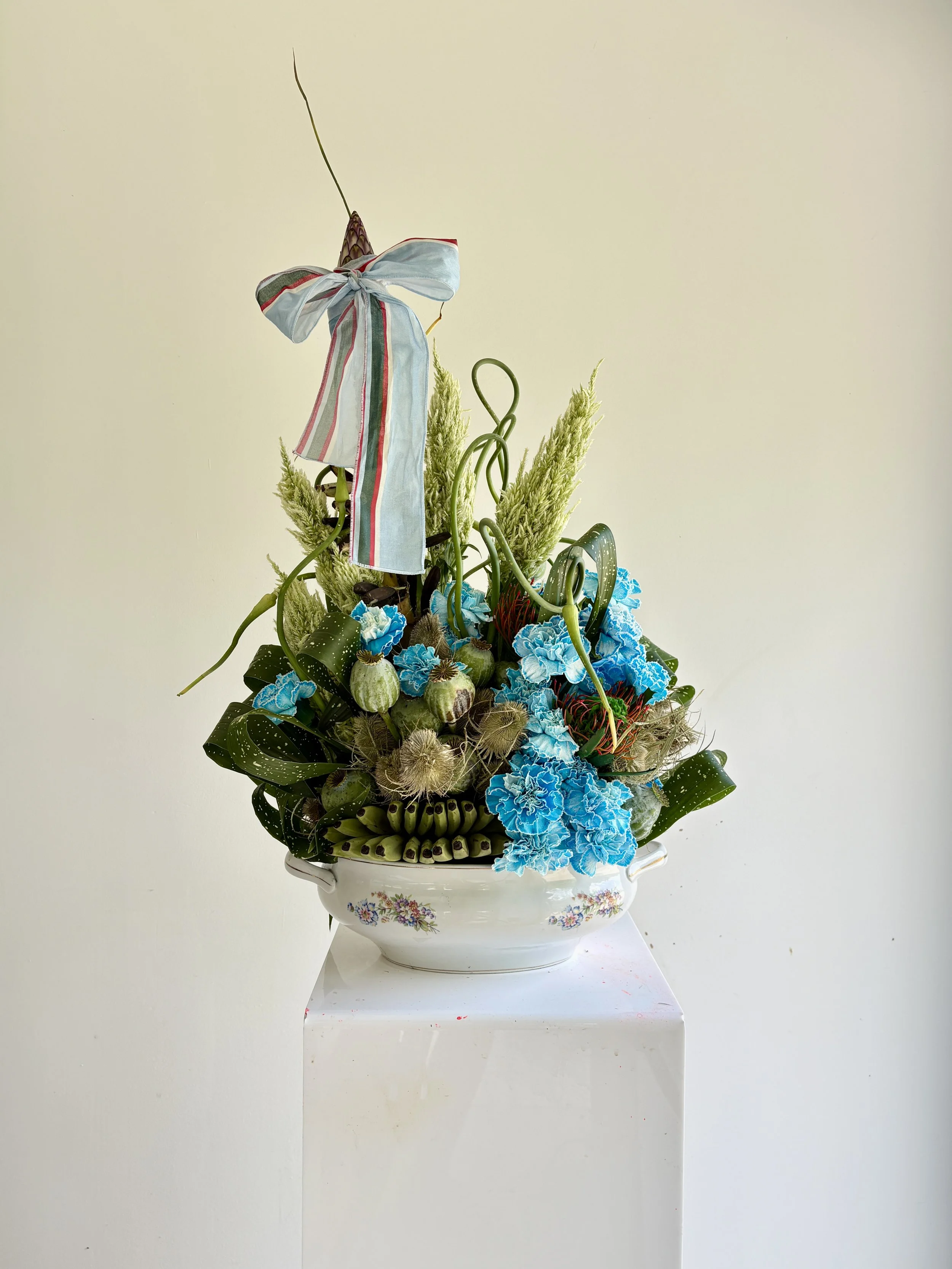 Bespoke luxury floral composition created for Blanca Miró by Mosaic Flowers, gifted by La Veste to celebrate the birth of her daughter, featuring rare blue hydrangeas, sculptural botanicals and premium blooms in an elegant vintage vase.