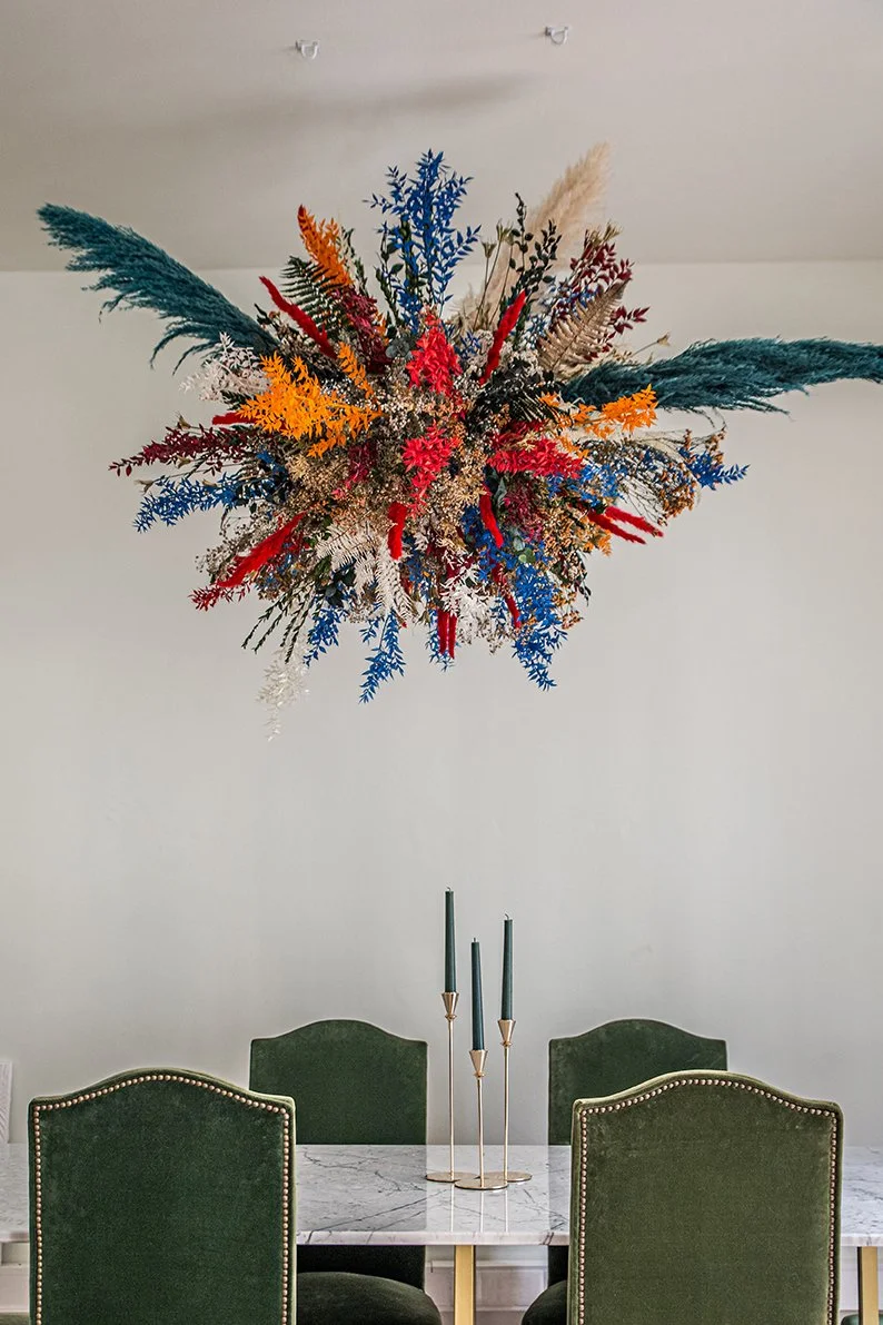Floating sculpture made of dried preserved flowers that are painted