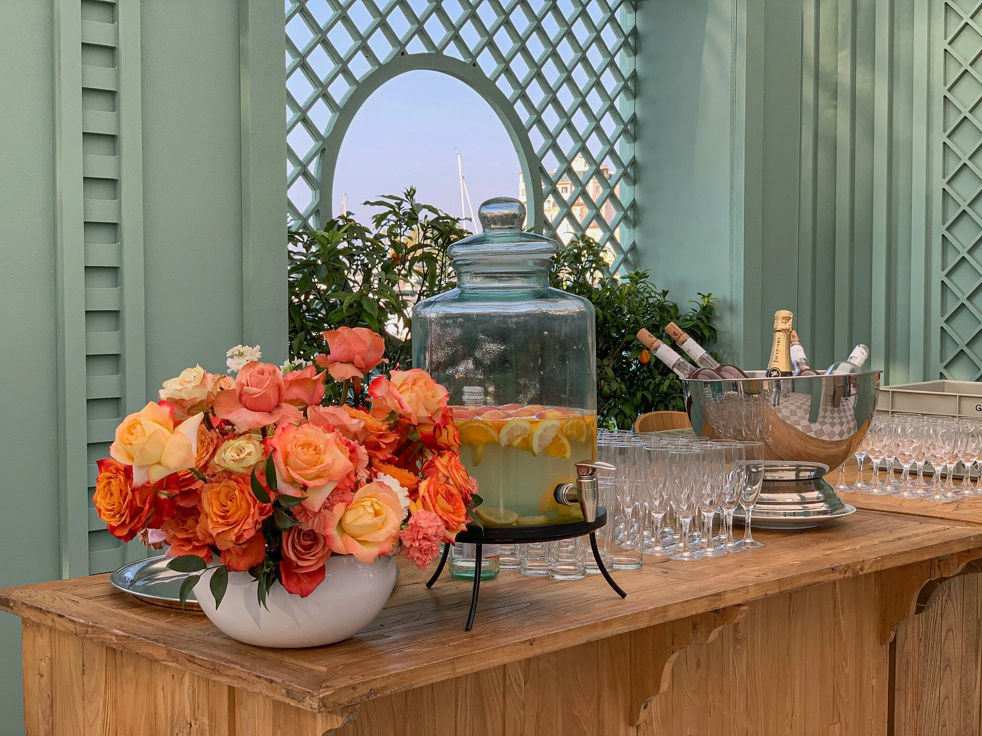 Drink station styled with citrus and roses at Amazon’s Le Pantiero lounge, Cannes Lions Festival.