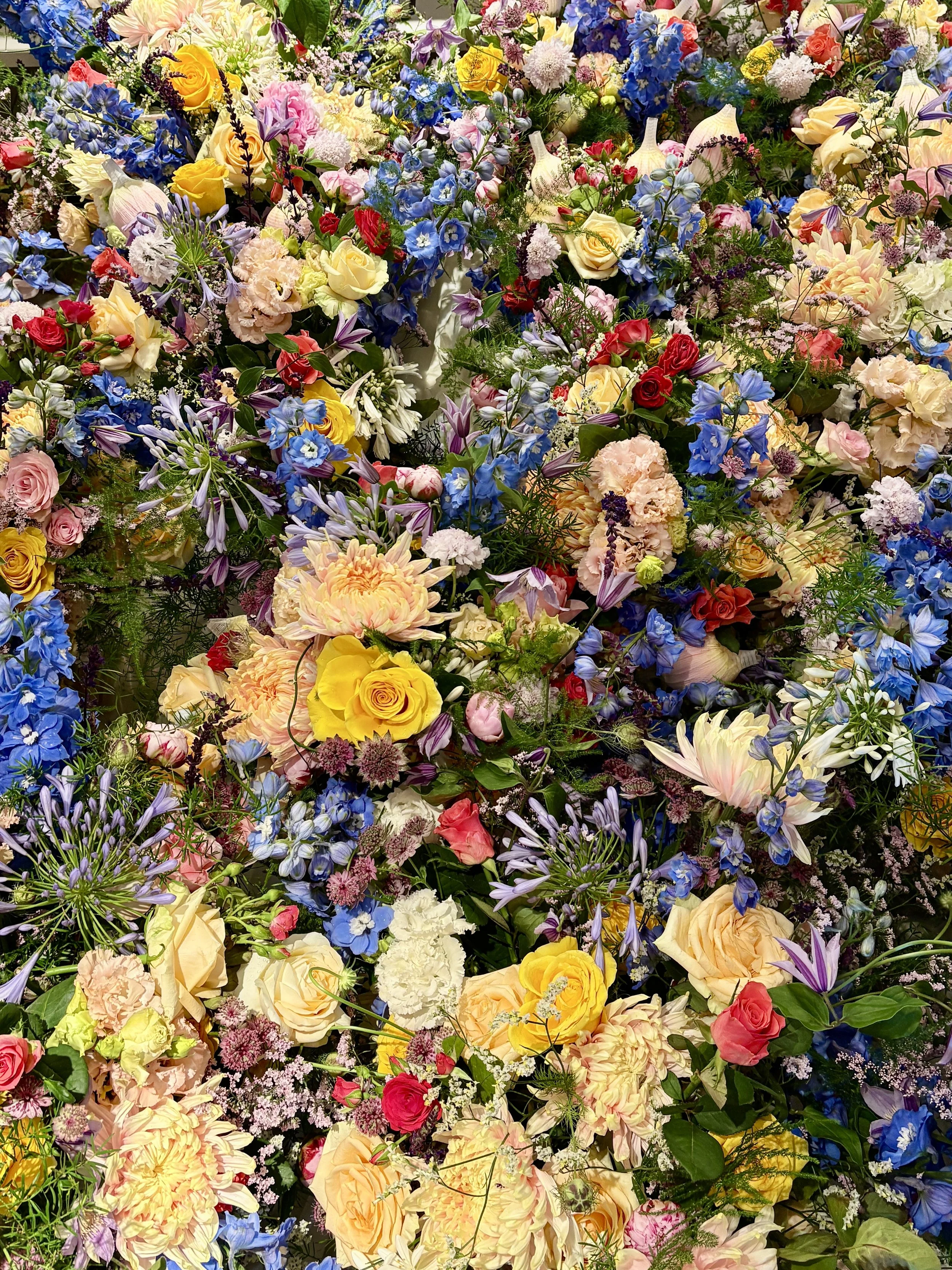 Immersive luxury floral wall created for the FOX VIP event at the Ritz-Carlton Suite, featuring premium seasonal blooms in an artistic botanical installation for an international luxury brand event
