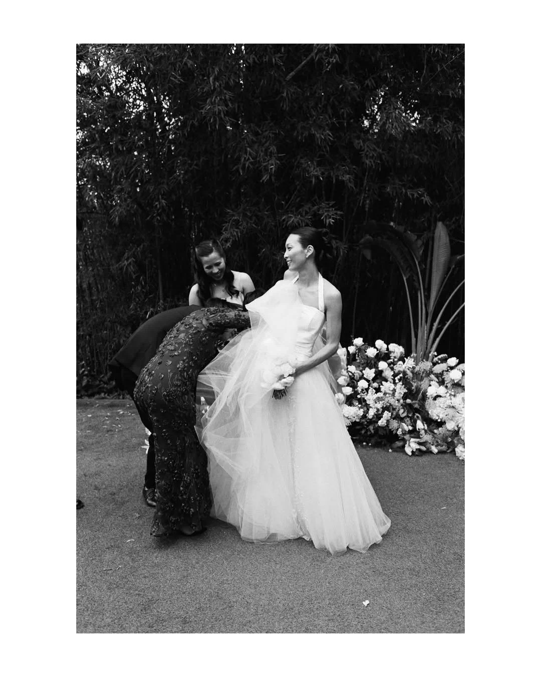 Intimate moment shared by Christie and Andrew surrounded by bespoke floral installations created for their luxury wedding at Villa Almanita, Catalunya