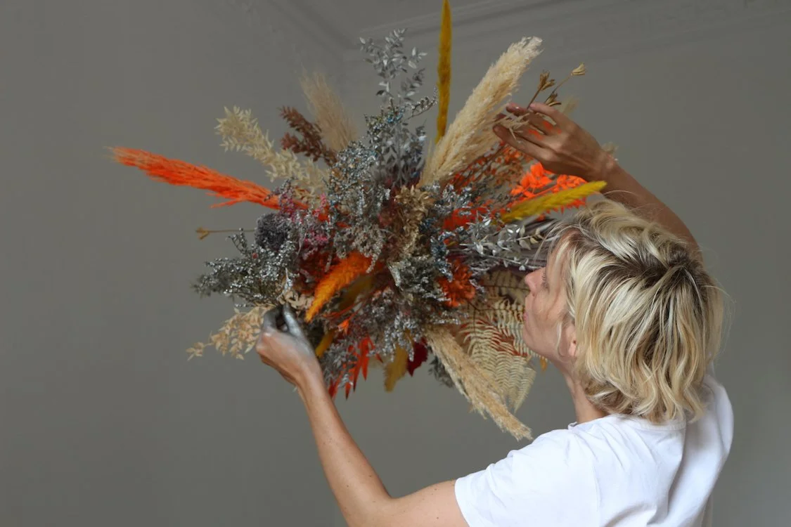 Mosaic’s founder and floral artist Margaux working on a luxury floral art installation in Barcelona