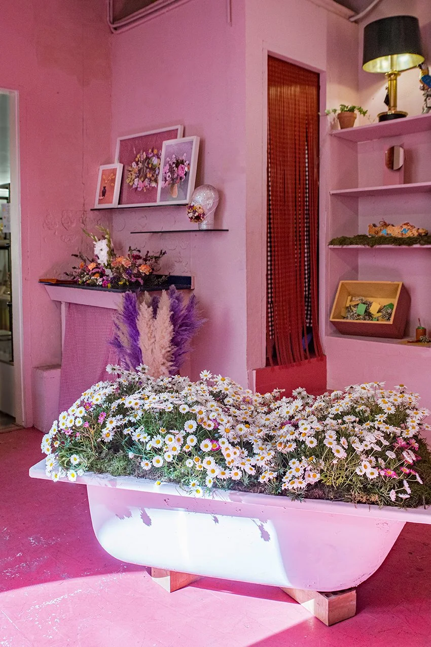 Immersive bathtub filled with flowers designed by Mosaic for “The Flower Experience"