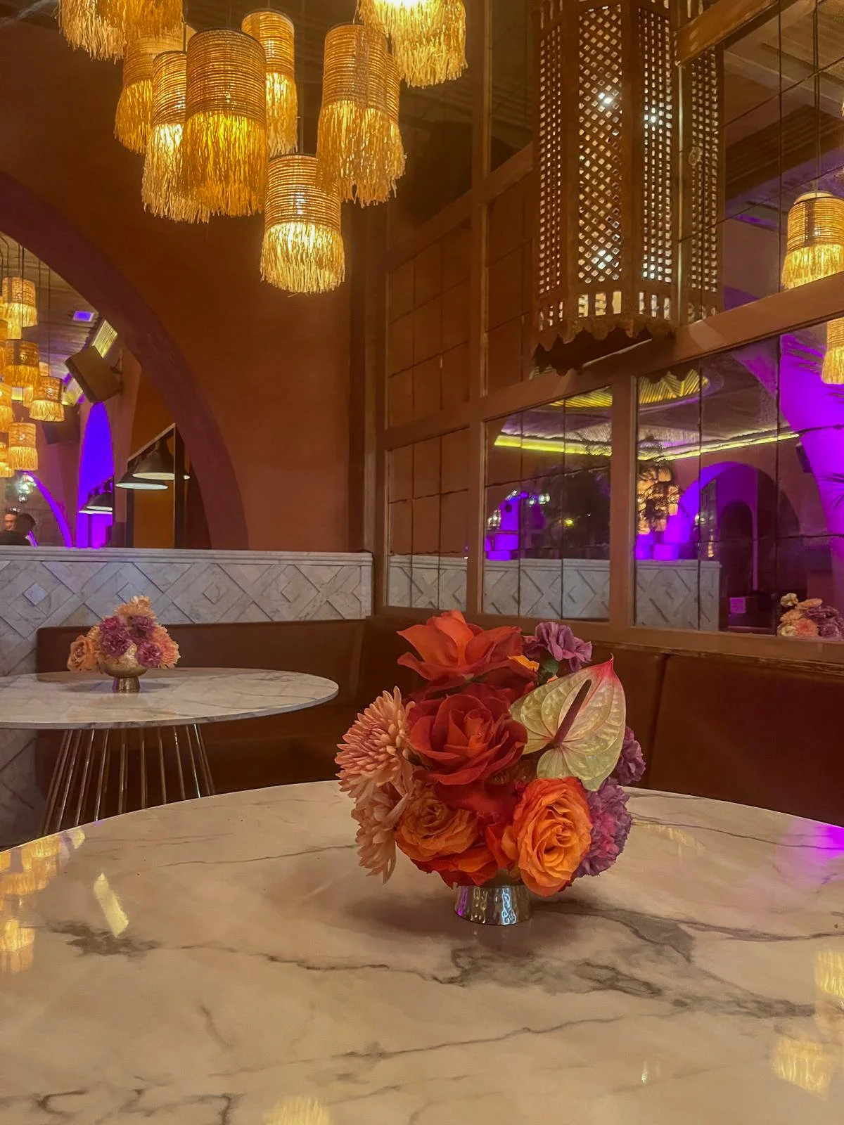 Amazon dinner at Salama restaurant during Cannes Lions Festival styled by Mosaic Flowers with vibrant floral arrangements