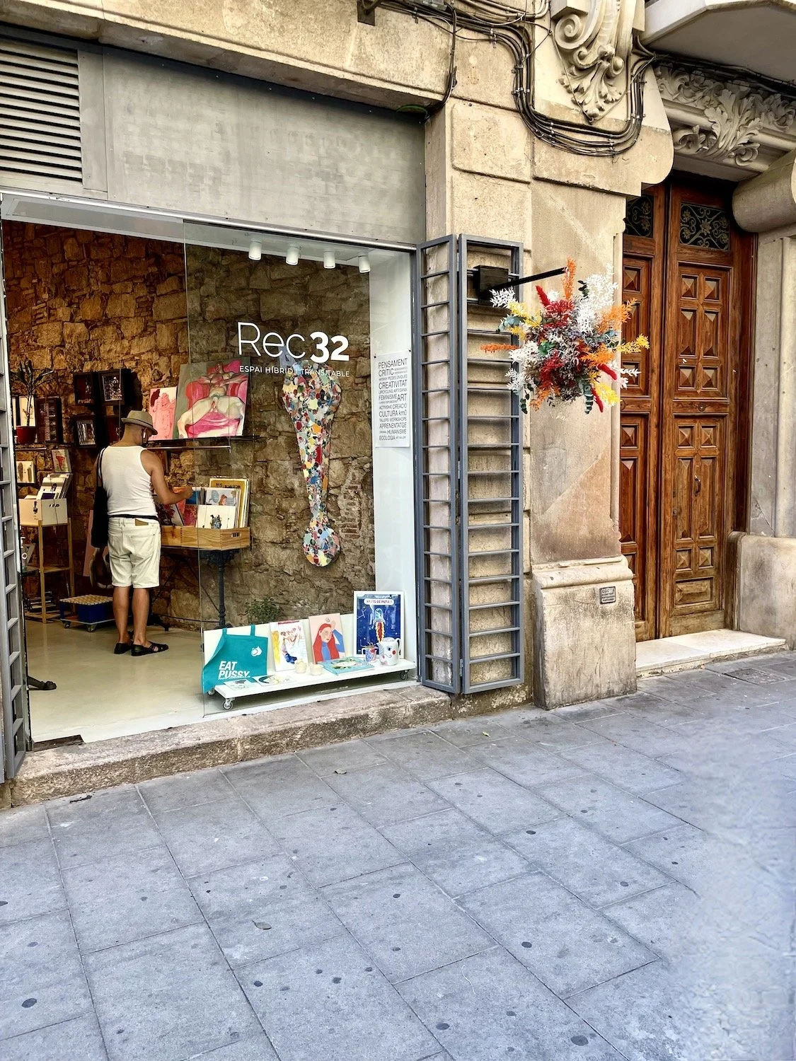 Colorful floating flower explosion by Mosaic displayed in Barcelona gallery window