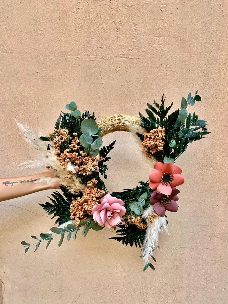 Handmade festive wreath created with dried preserved and paper flowers in Mosaic Flowers Barcelona workshop