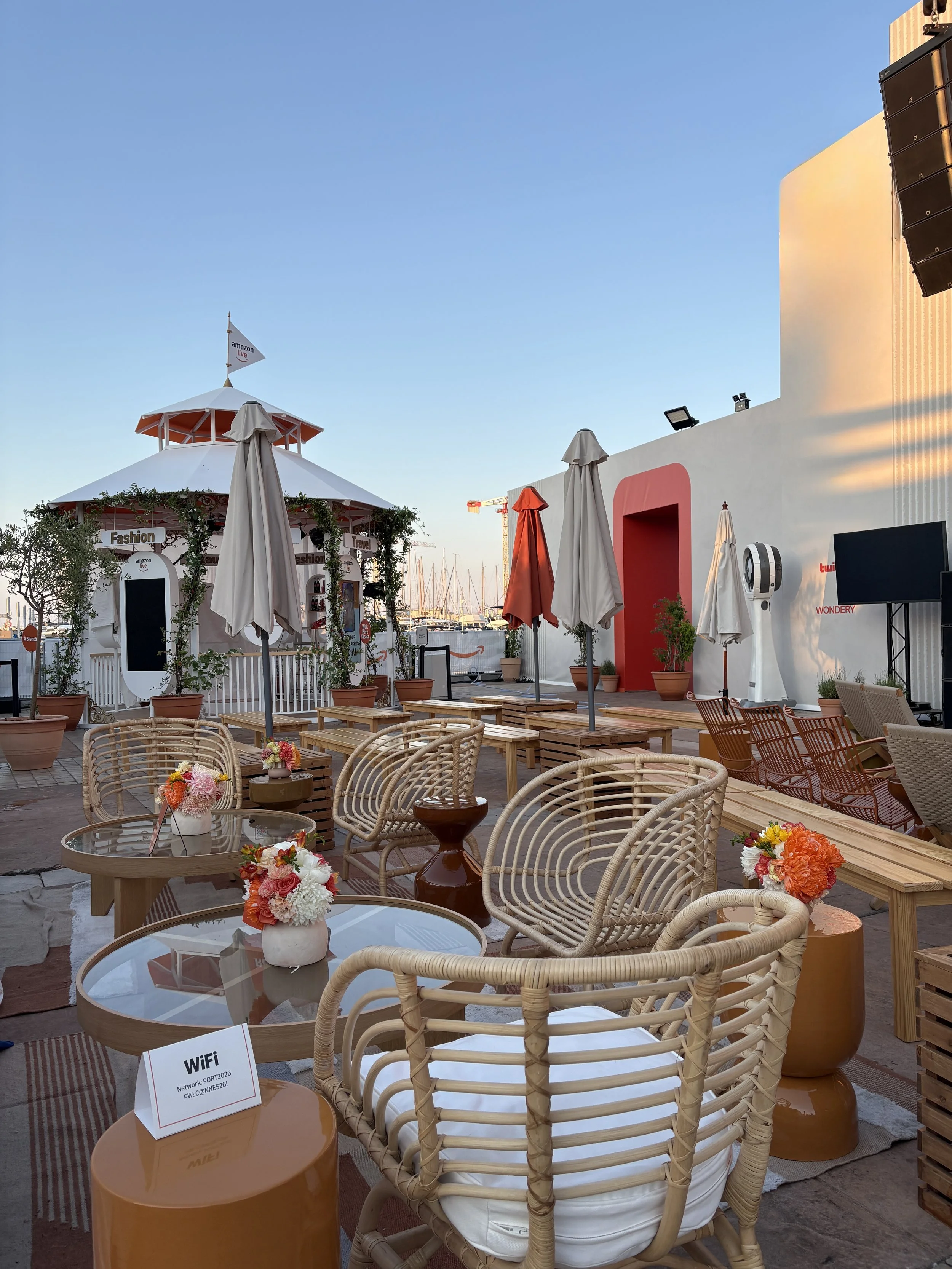 Luxury floral styling by Mosaic Flowers for an outdoor hospitality lounge at the Cannes Lions Festival, featuring generous seasonal arrangements for an international brand event.