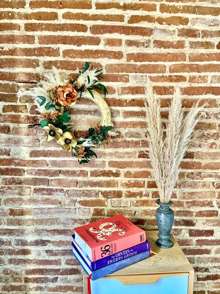 Lifestyle image of festive wreath decor styled by Mosaic Flowers in Barcelona for international events