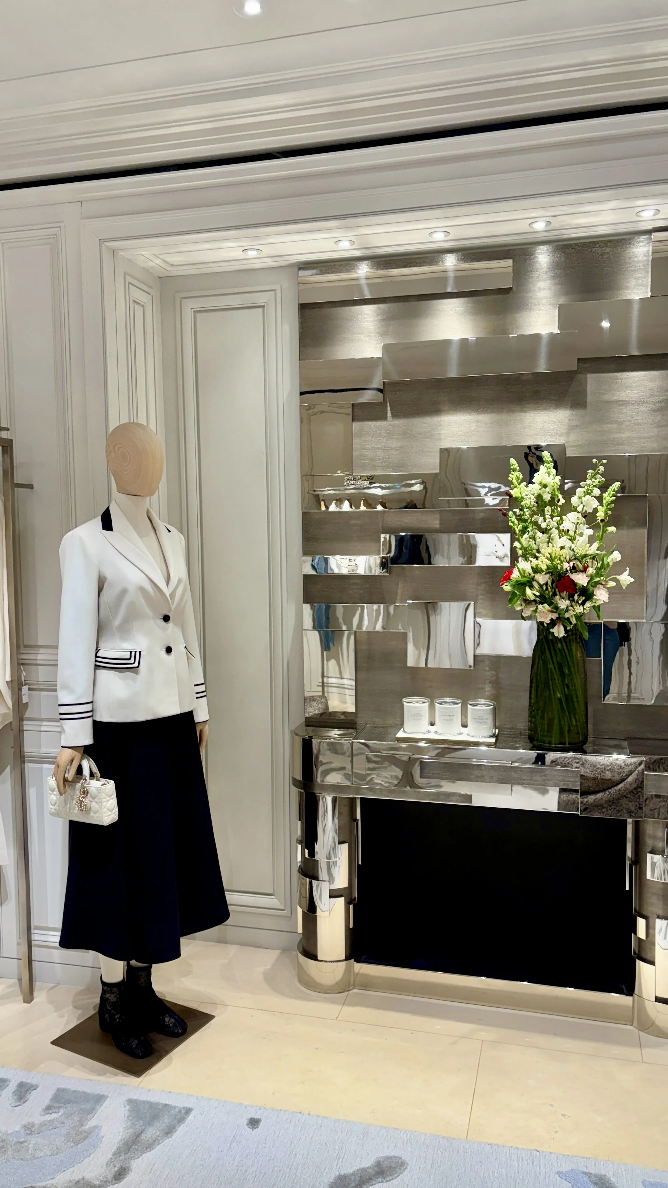 Artistic luxury floral composition in a contemporary vase, created for a flagship boutique in Barcelona as part of the Spring Summer 2027 collection