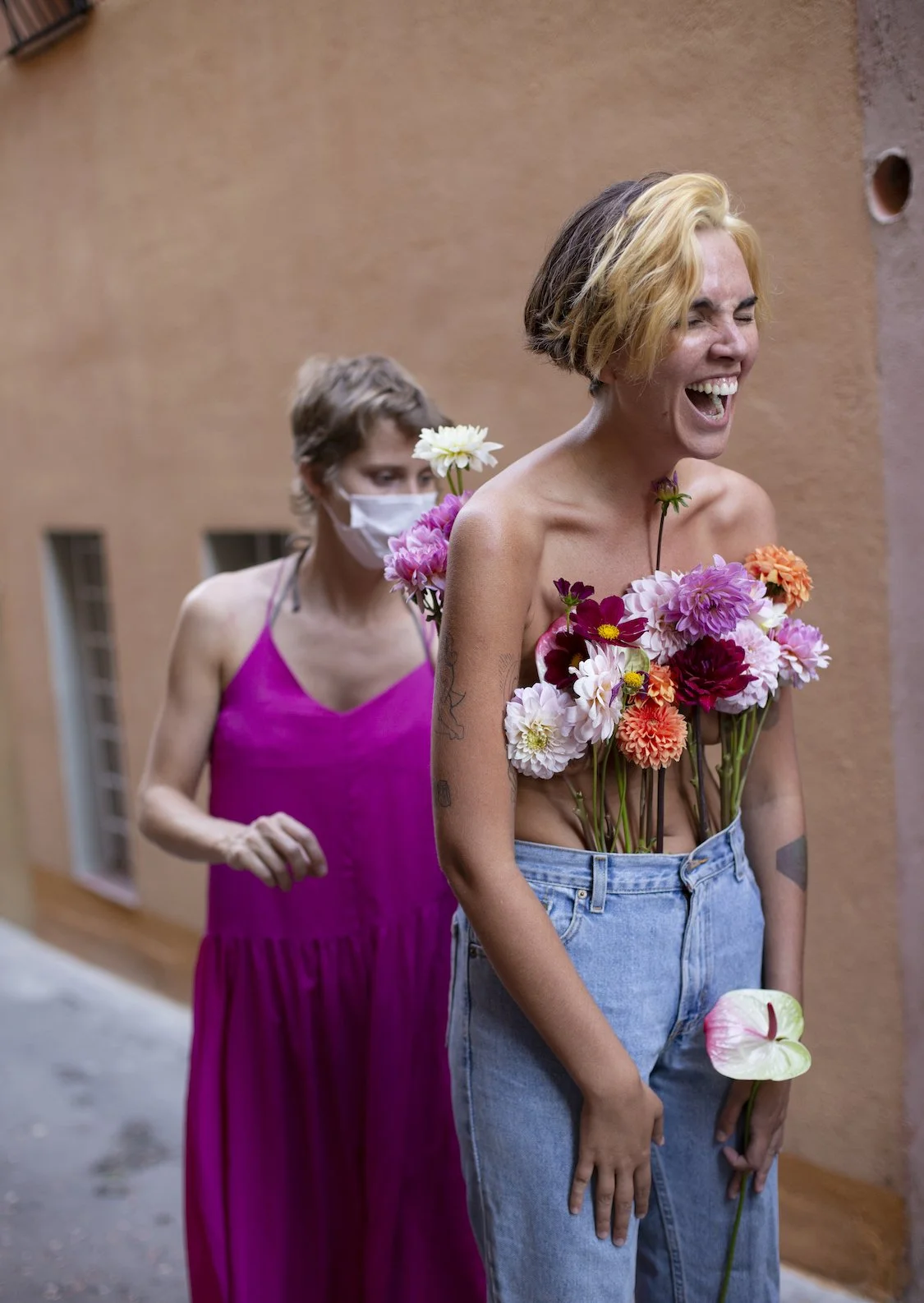 Laughing model with floral bouquet styled by Mosaic Flowers in Gracia Barcelona editorial shoot