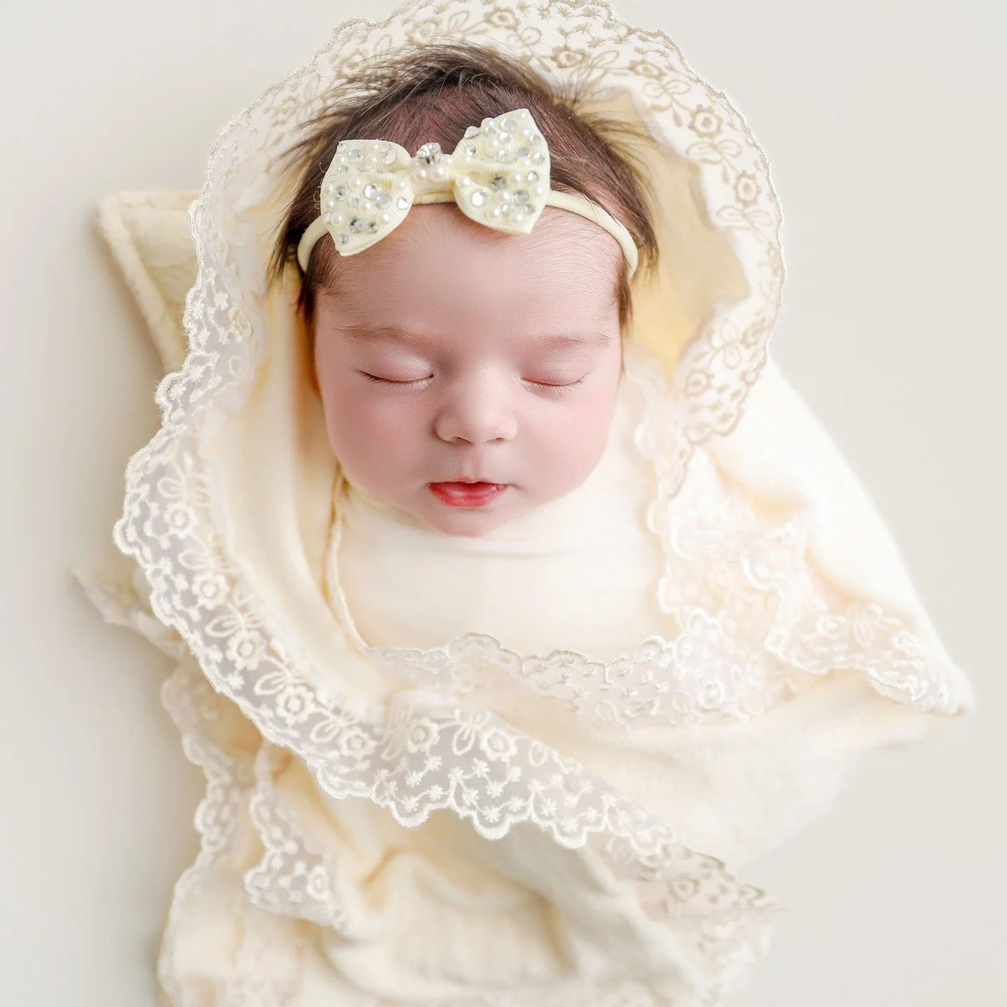 Five days a week, our seamstresses are sewing and creating beautiful new pieces for your studios and my clients. I personally shop wholesale for all of our fabrics, and we always choose limited-edition materials so not every photographer ends up with