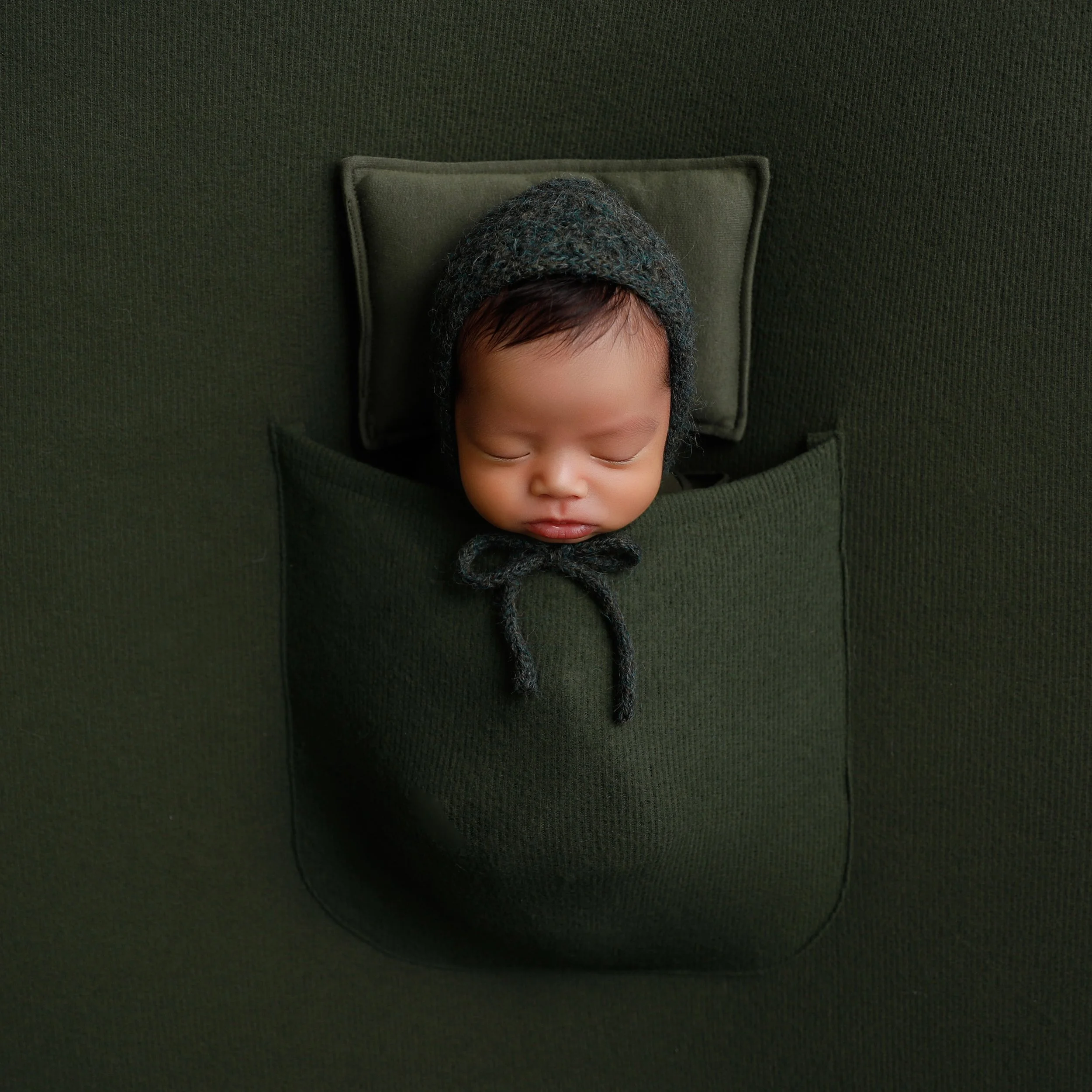 Our pocket blankets are one of my favorite things I just love slipping babies in here they just look so cozy.