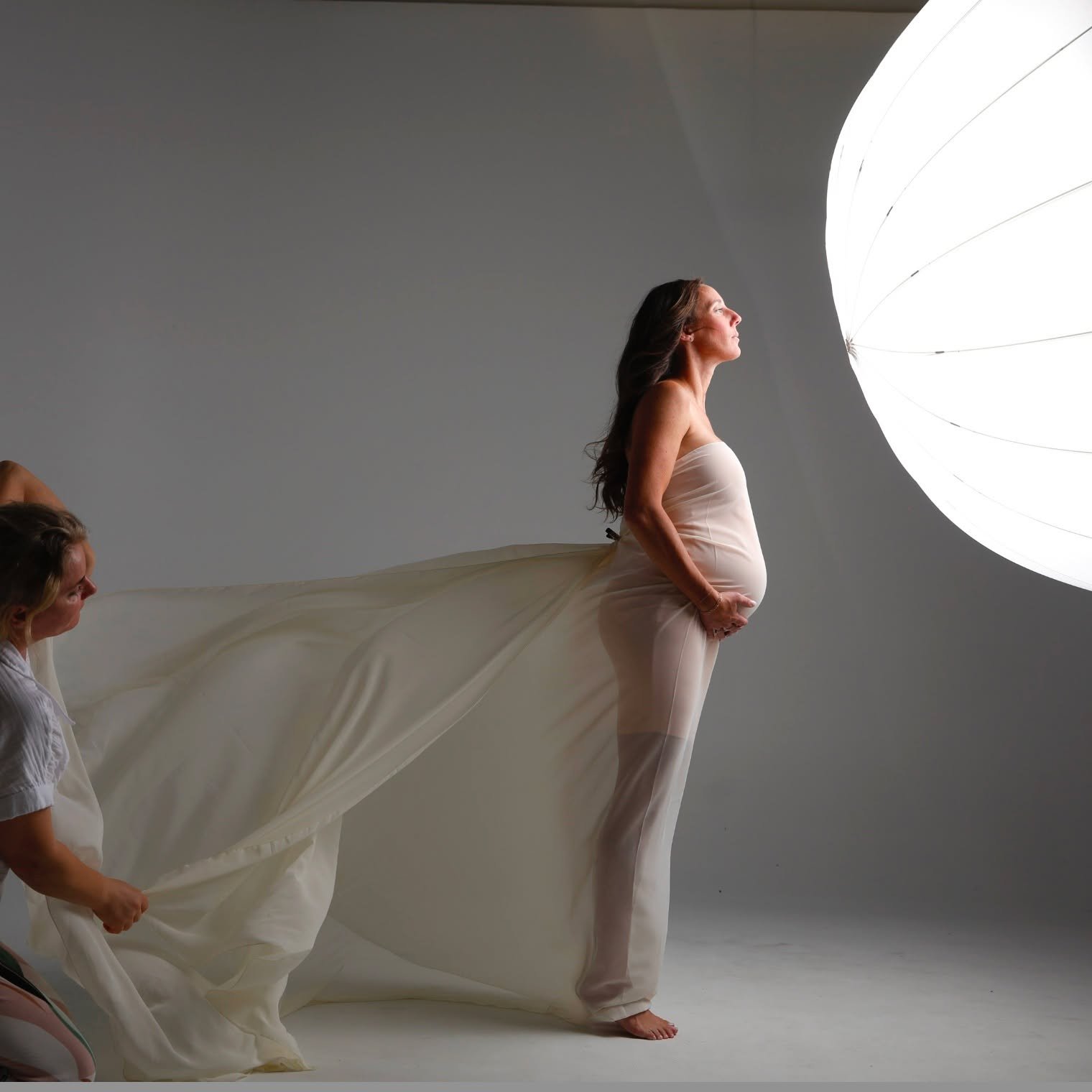 BTS behind the scenes...single light 65" shoot thru...5 years of tossing fabric and she is wearing a tube under...shot In our cyc room that is a 20x20 cyc wall my son built. We also rent this part of our studio out to creators and photographers 