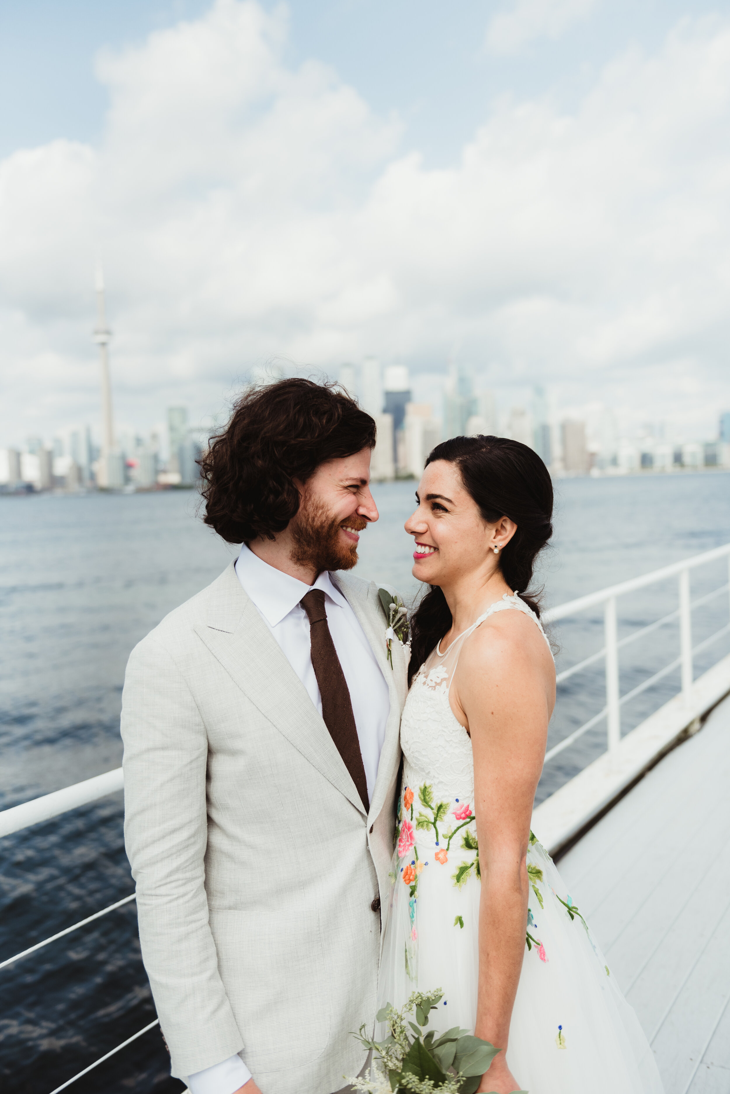 Bride and groom portrait on pier