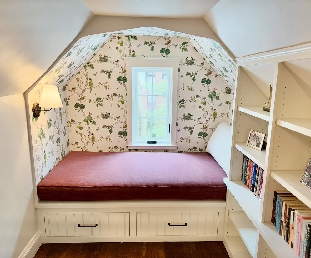After: A happy little book nook that moonlights as a guest bed