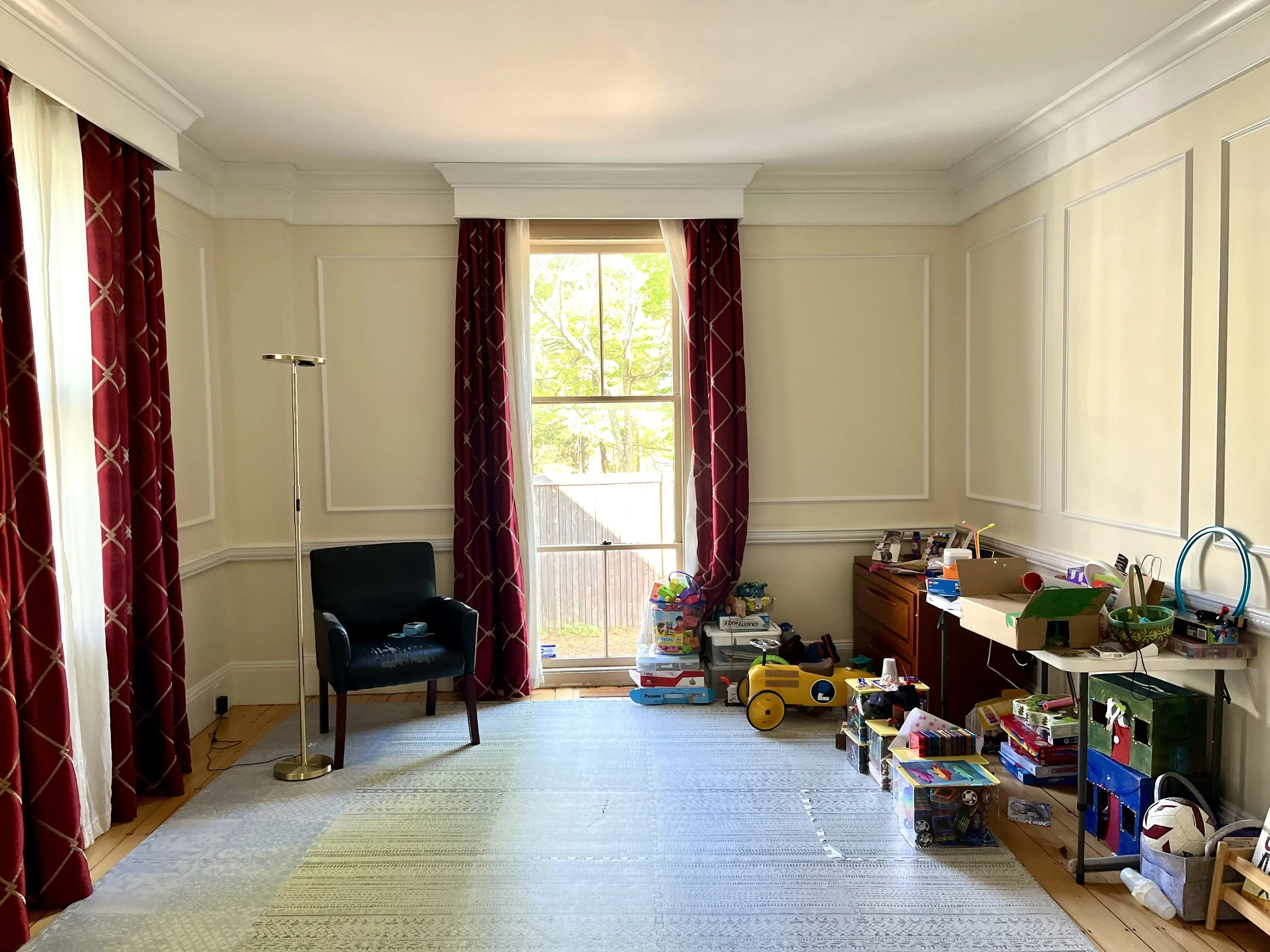 Before: An oversized large "ballroom" with no access to the driveway