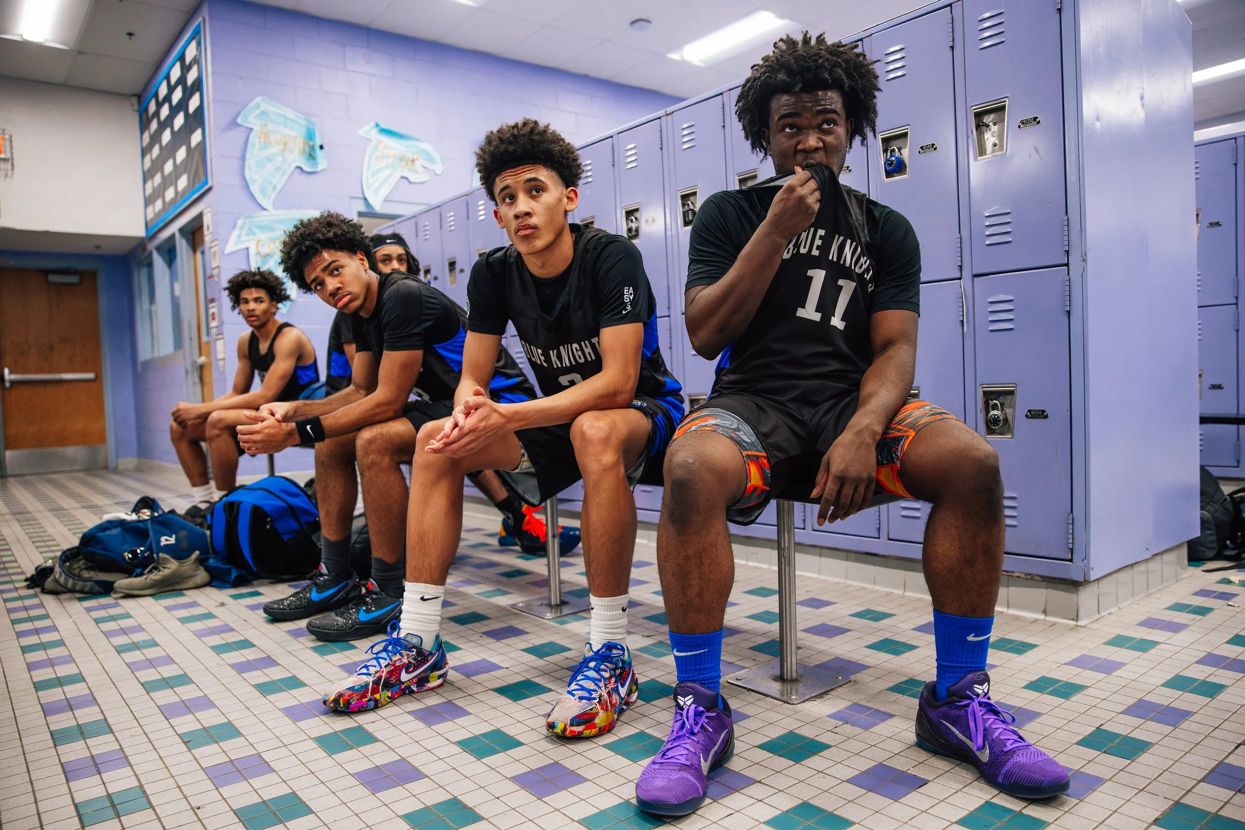 Democracy Prep players listen to their coaches during a halftime pep talk at Foothill High School Friday, Dec. 12, 2025, in Henderson. 
