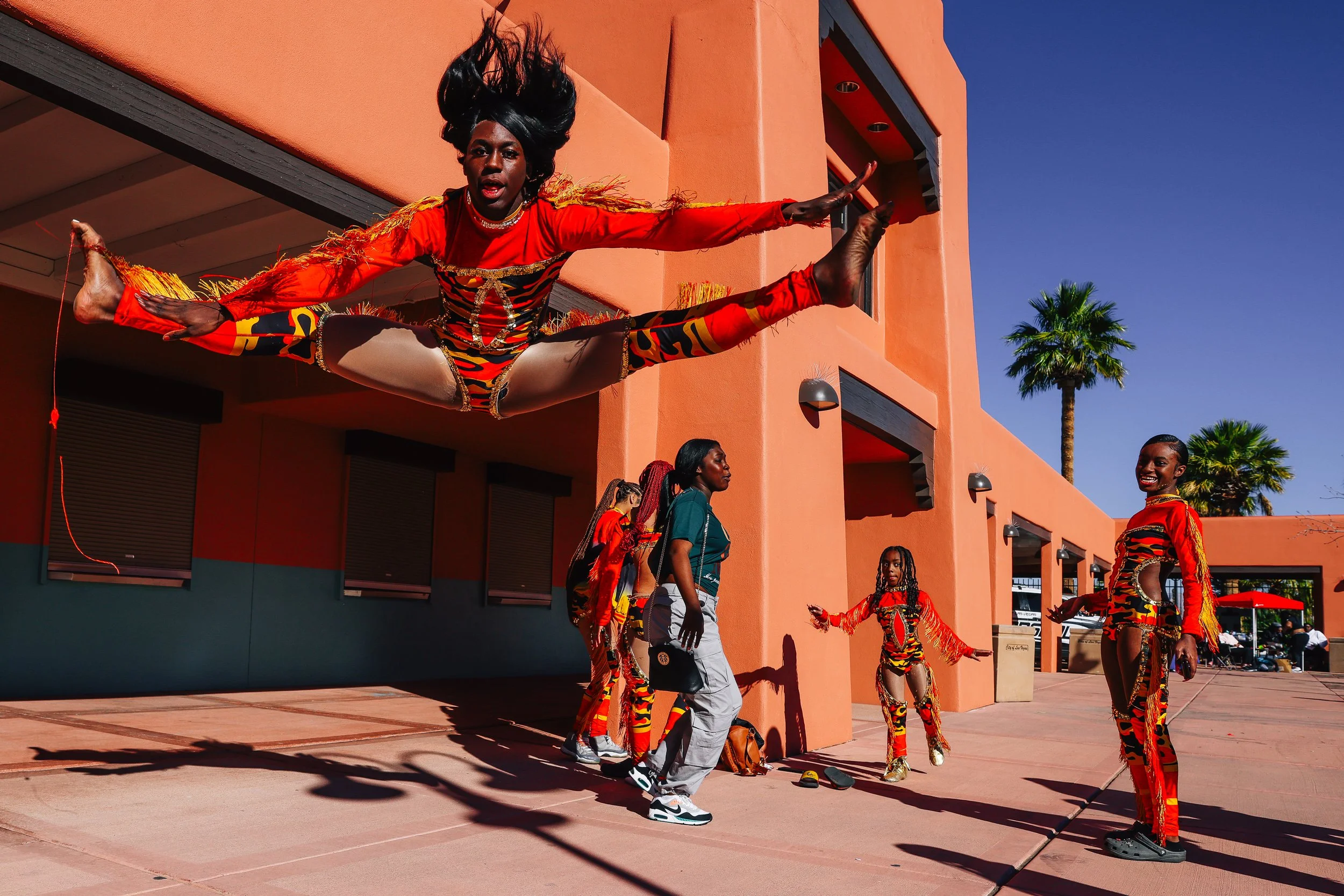 A dancer from the Explosive Dynamites Dance Team practices a toe-touch before performing during the Night of Expressions Youth Talent Showcase at Lorenzi Park Saturday, Feb. 3, 2024, in Las Vegas.