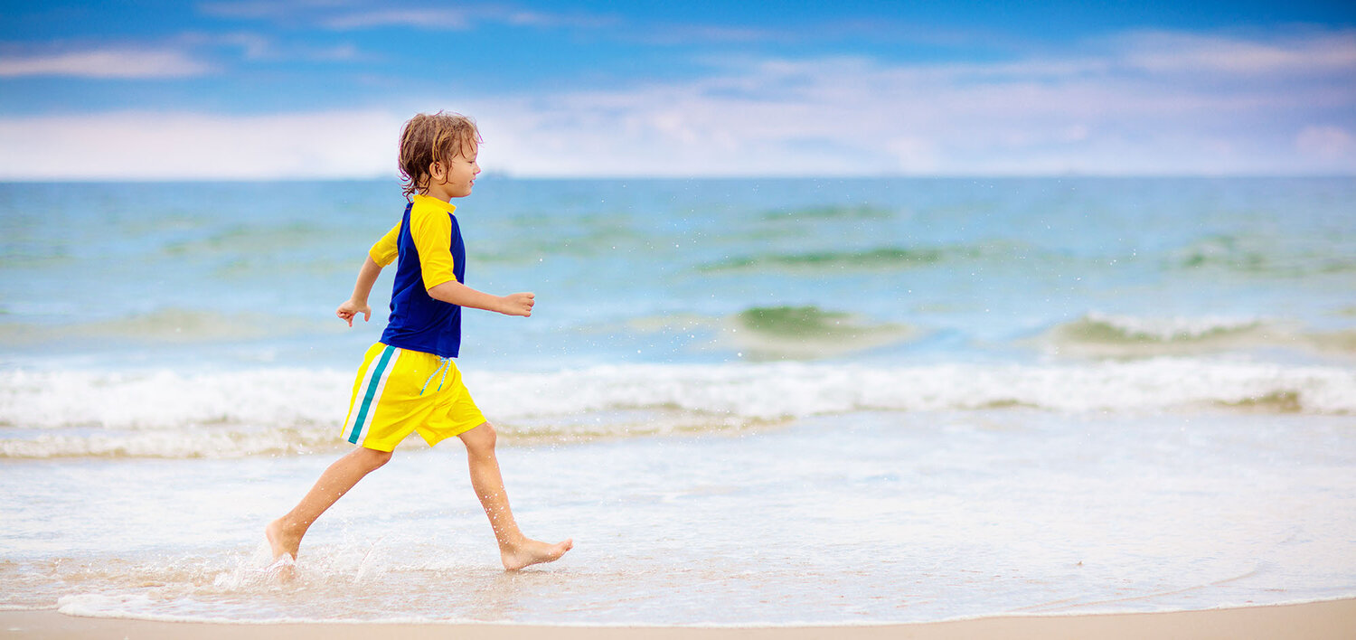 Boy with Autism walks on the beach.jpg