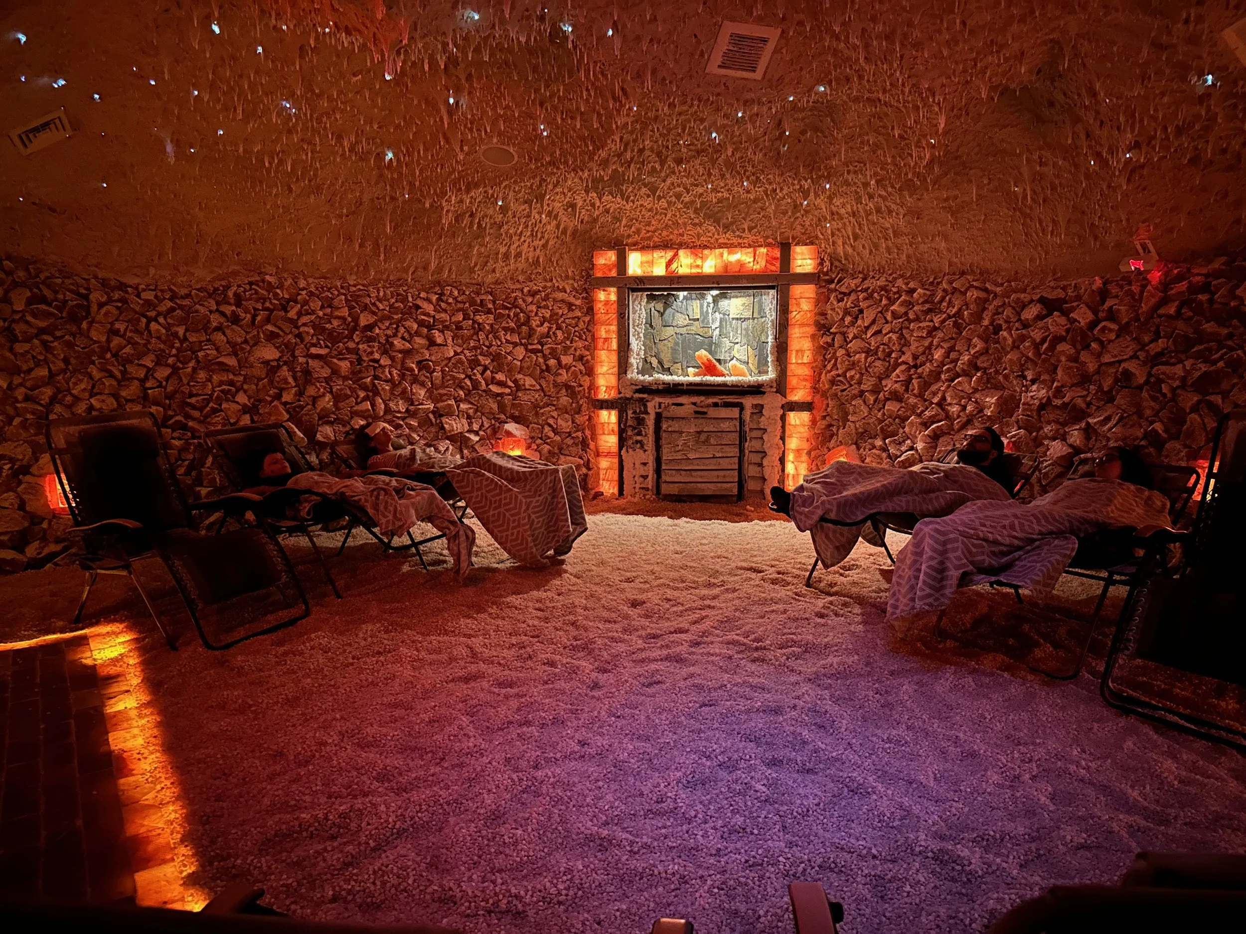 Salt cave with warm amber lighting and salt walls