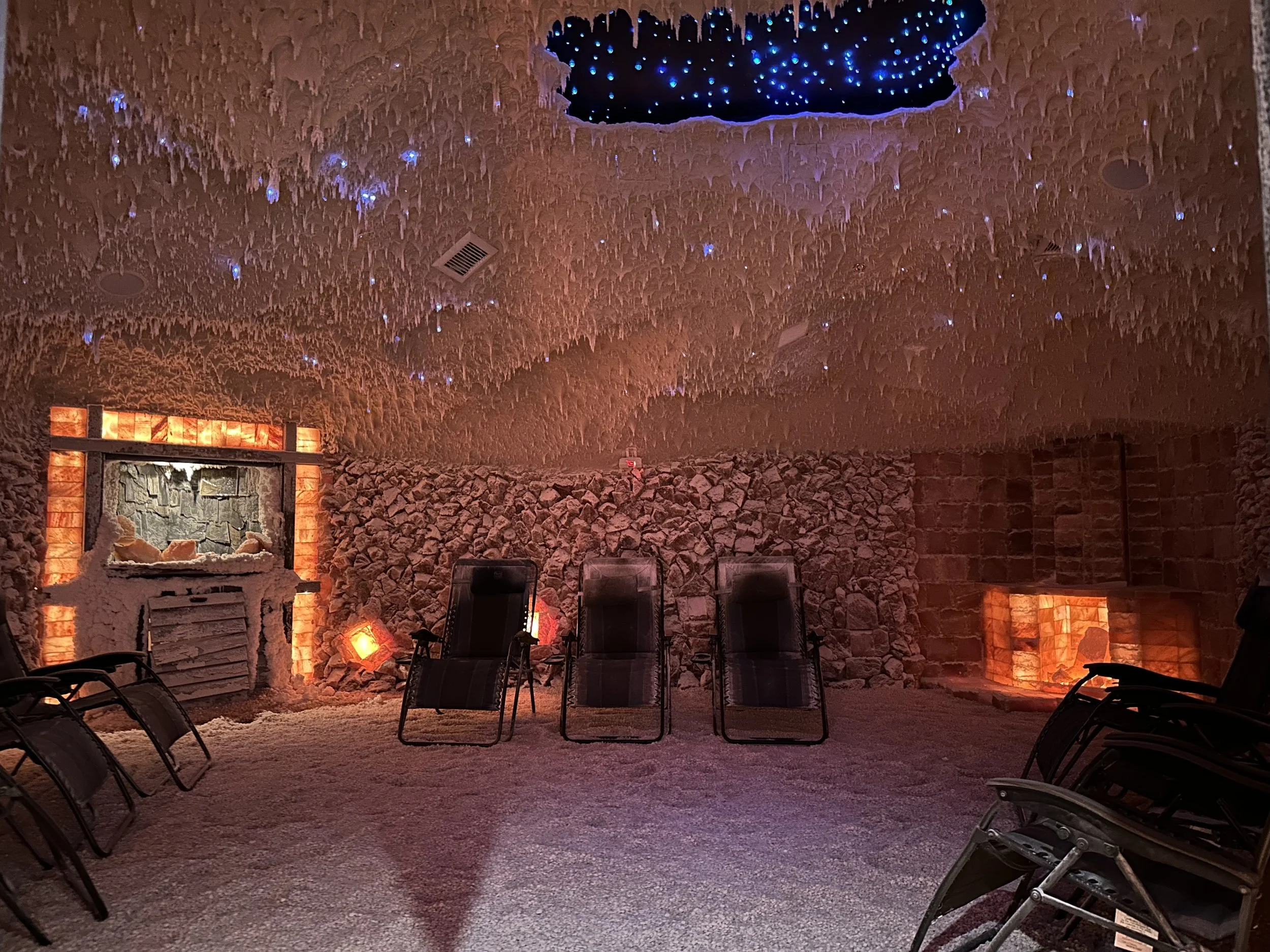 Group salt therapy session inside a salt cave