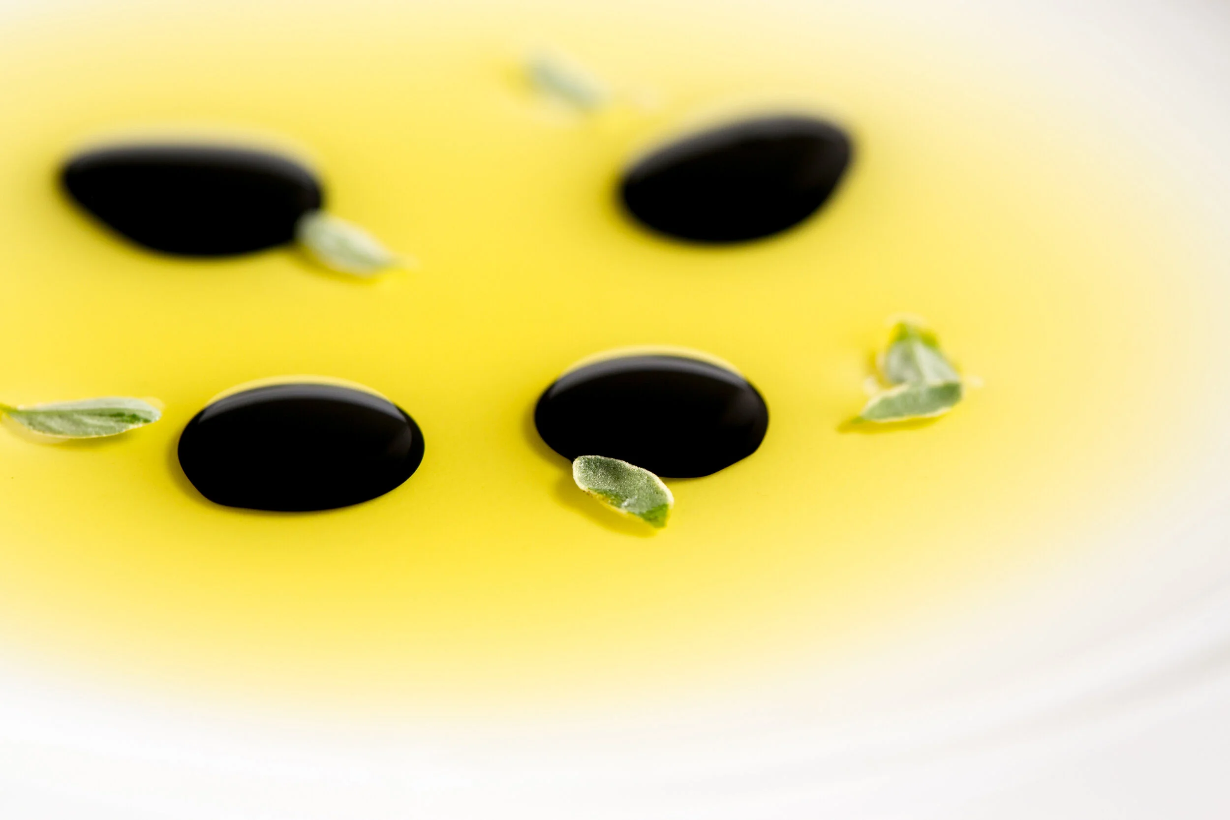 Close-up of balsamic glaze and extra virgin olive oil.