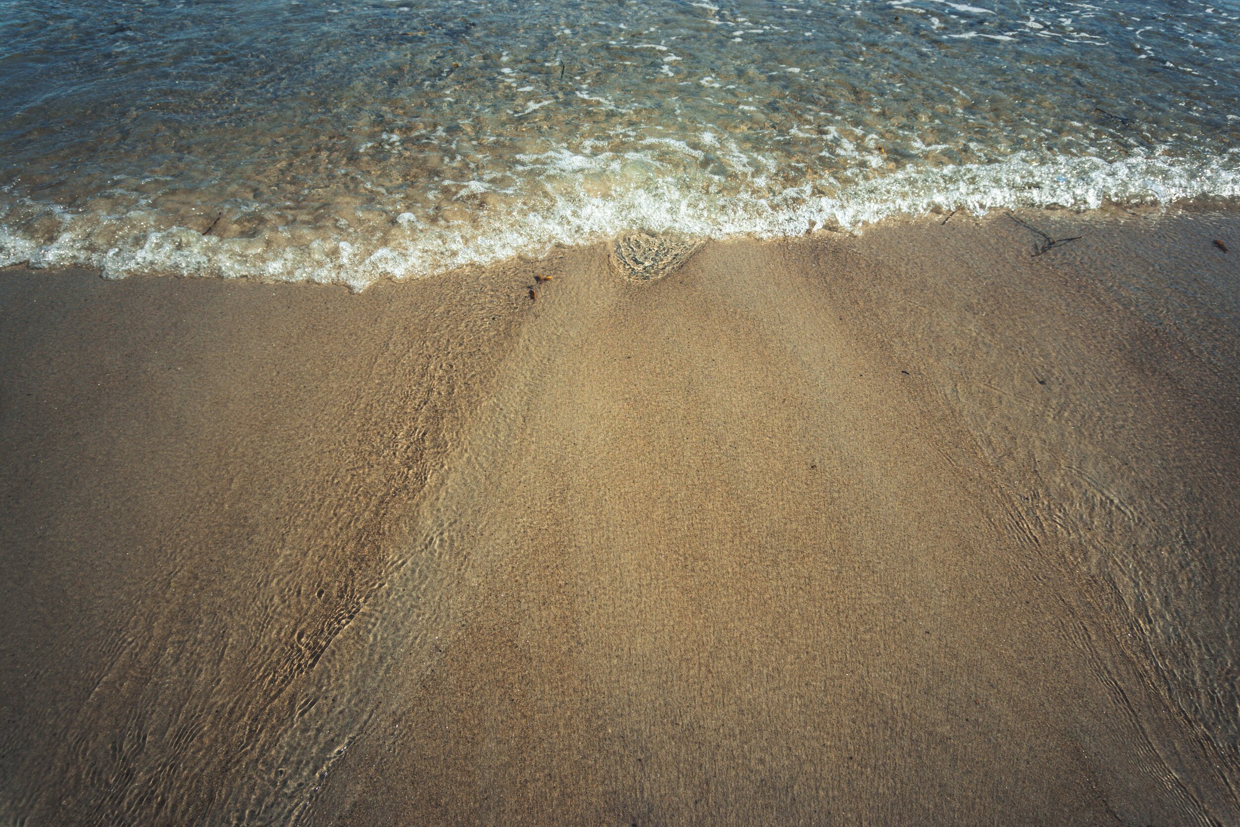 Waves on a sandy Maine beach
