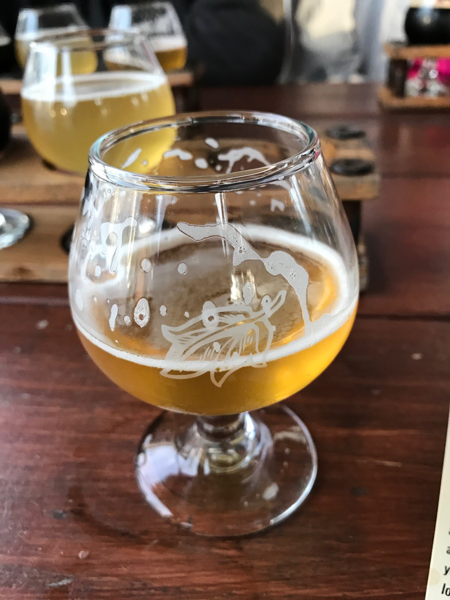 A glass of amber colored beer