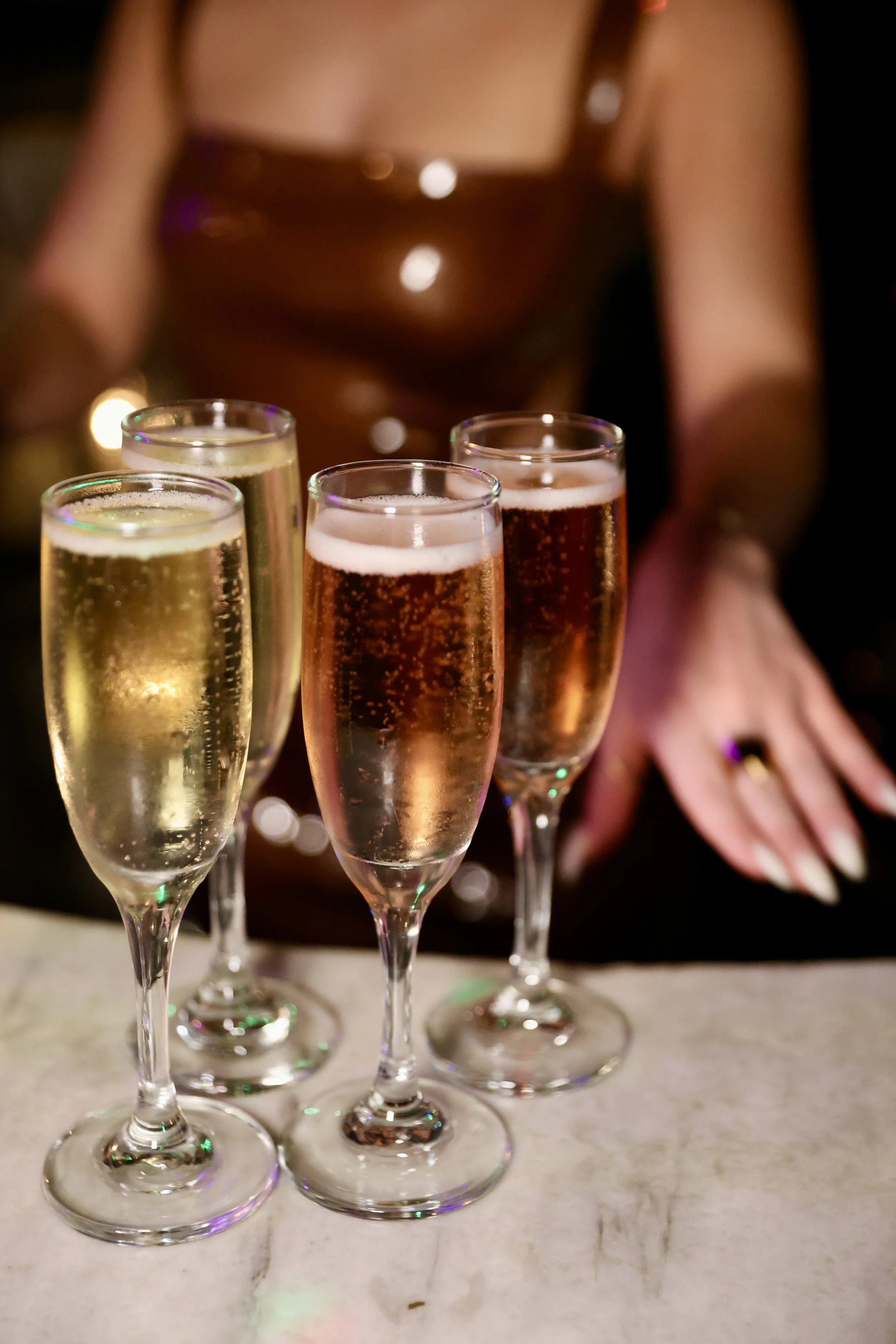 Guests toasting with champagne during New Year’s Eve celebration at TomTom Bar in West Hollywood