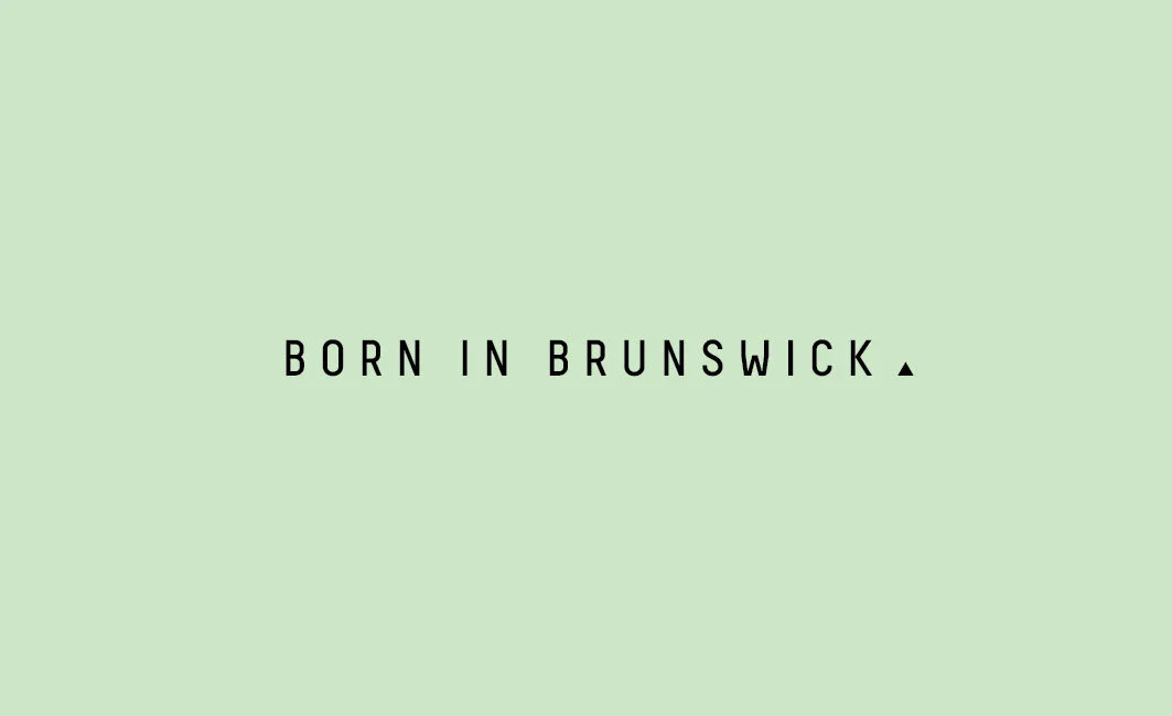 Text that says 'Born in Brunswick' on a light green background.