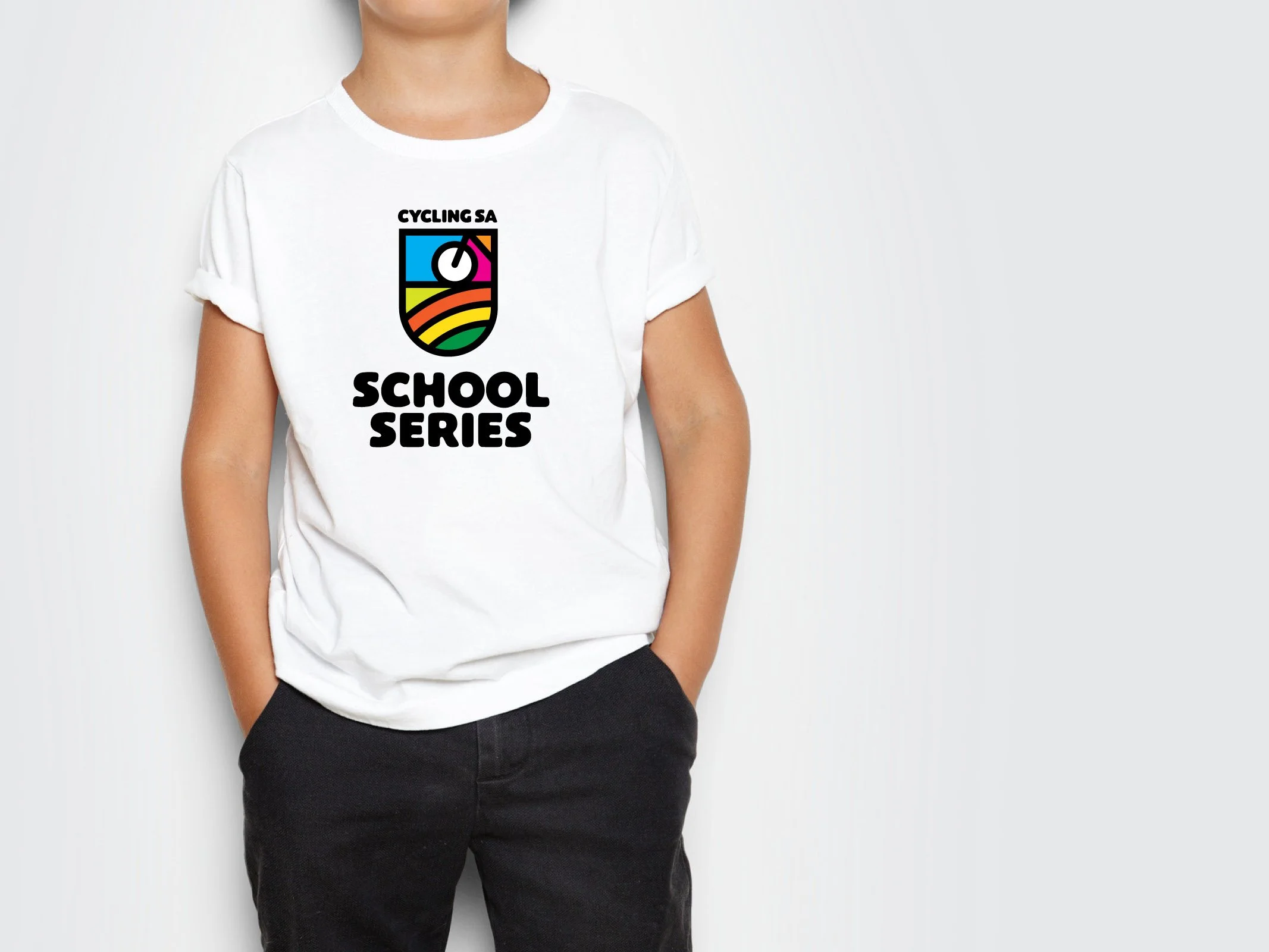Person wearing a white t-shirt with a colorful logo and the text 'Cycling SA School Series'