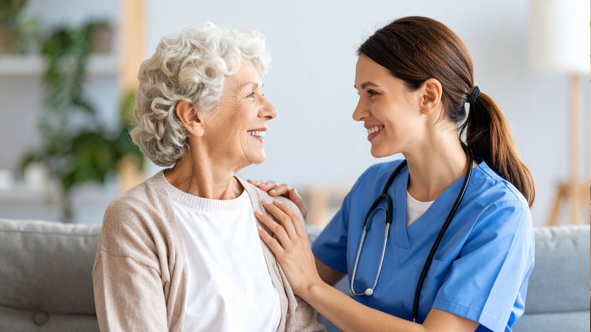 Caring Nurse Supporting Senior Woman at Home