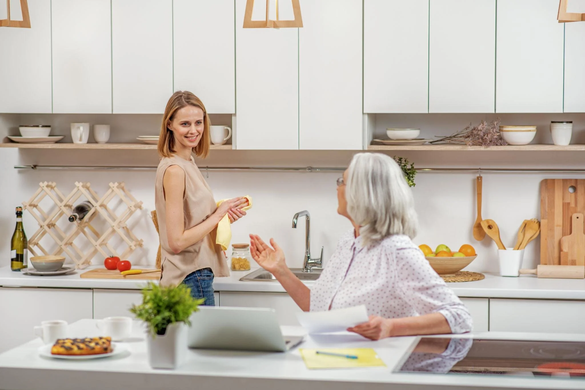 Adult daughter visiting Mom in the kitchen