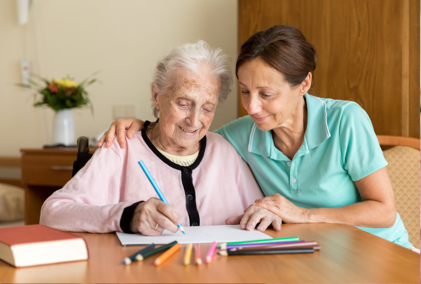 Home caregiver and senior adult woman