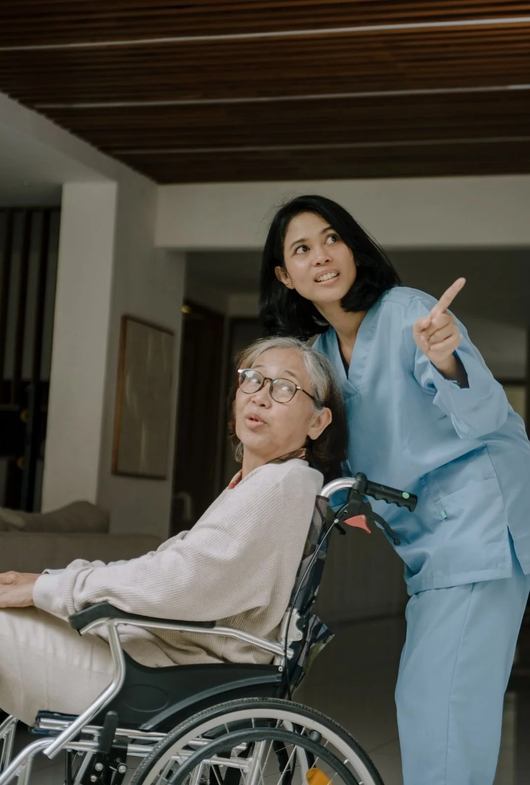 Nurse Taking Care of an Elderly Woman