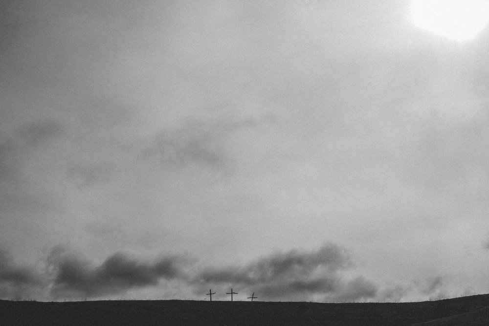 3 crosses against a stormy sky for Good Friday