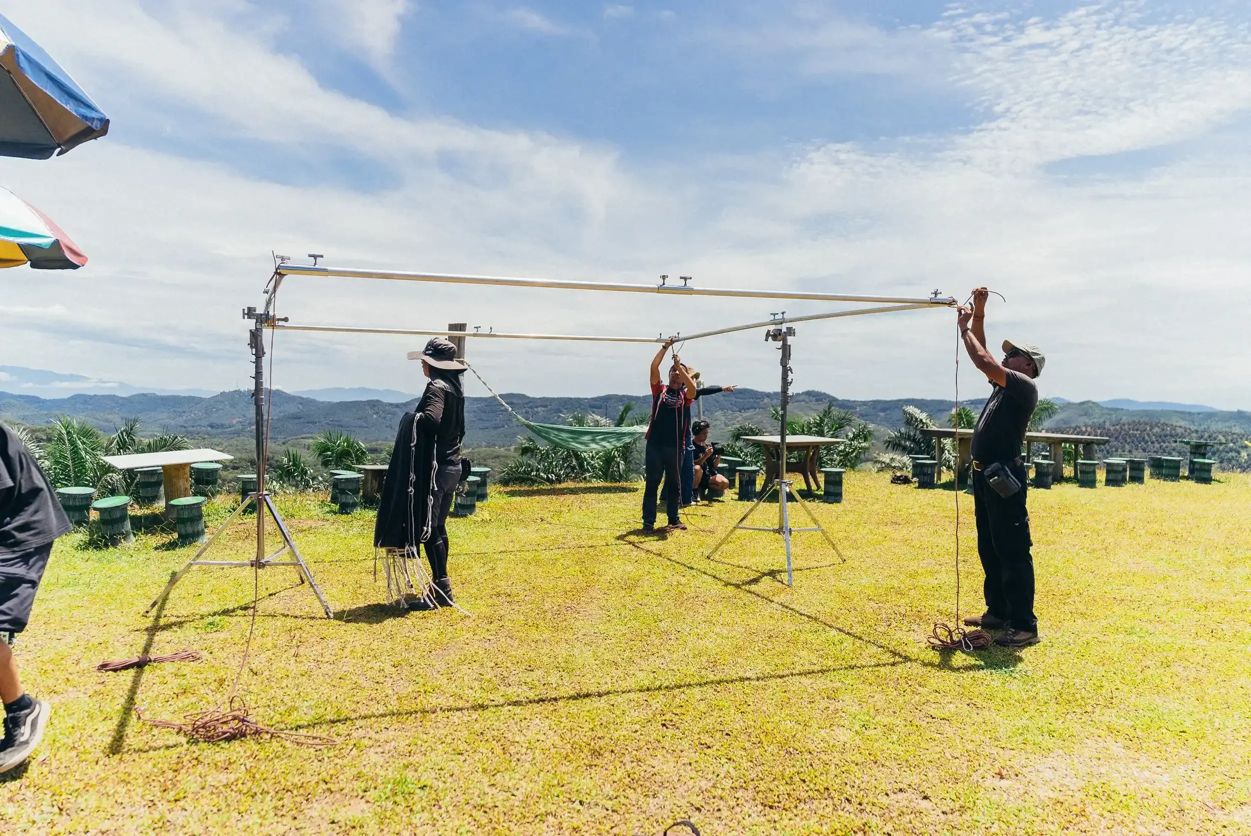 filming crews preparting equipment on the decathlon filming set.webp