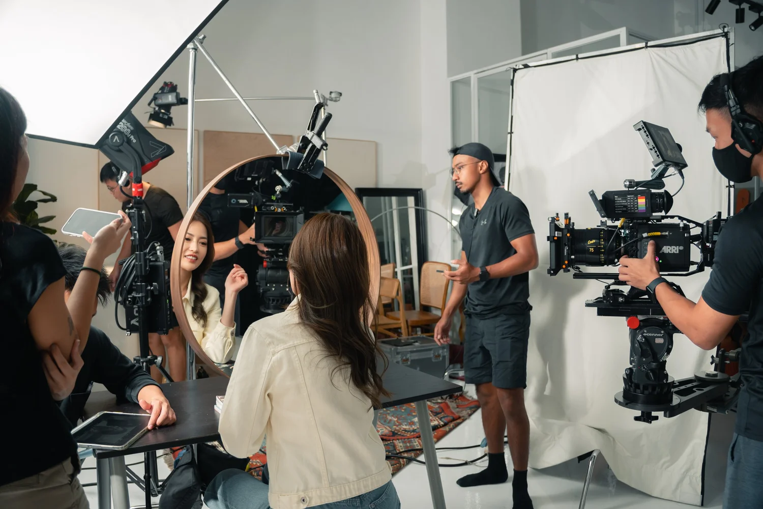 On-location production shoot with crew and lighting