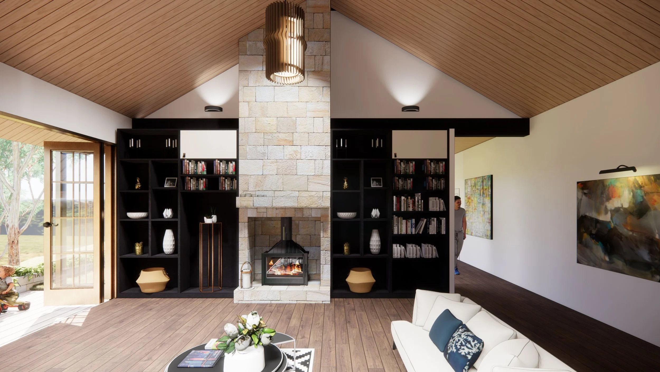 Living room with wood-paneled vaulted ceiling, central stone fireplace, black built-in bookshelves with decorative items, white sofa with pillows, round coffee table with flowers, large abstract painting on wall, and sliding door leading to outdoor s