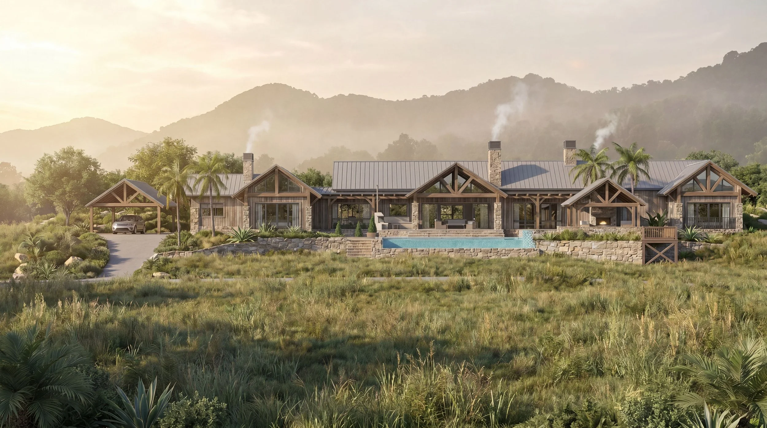 A modern house with stone and wood exterior, large glass windows, and a metal roof, surrounded by green landscape, palm trees, and mountains in the background.