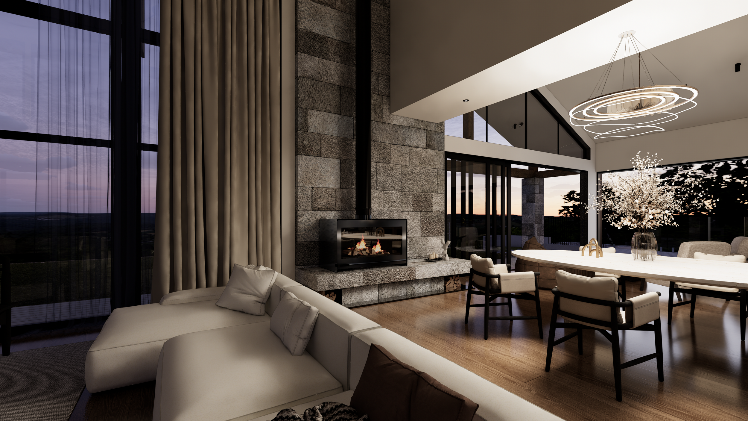 Modern living room with large windows, a fireplace, and a dining area with a floral centerpiece at sunset.