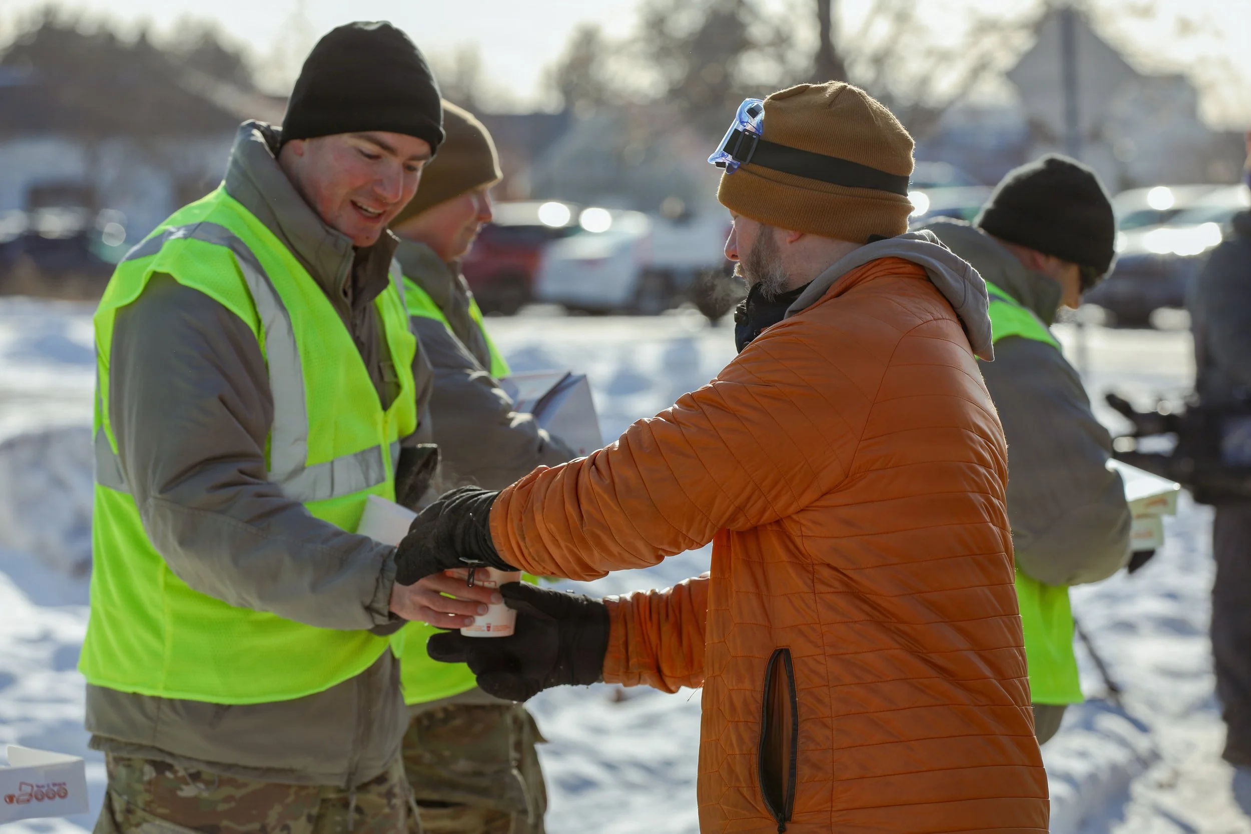 National Guardsmen handing out coffee and donuts to citizens in Minnesota