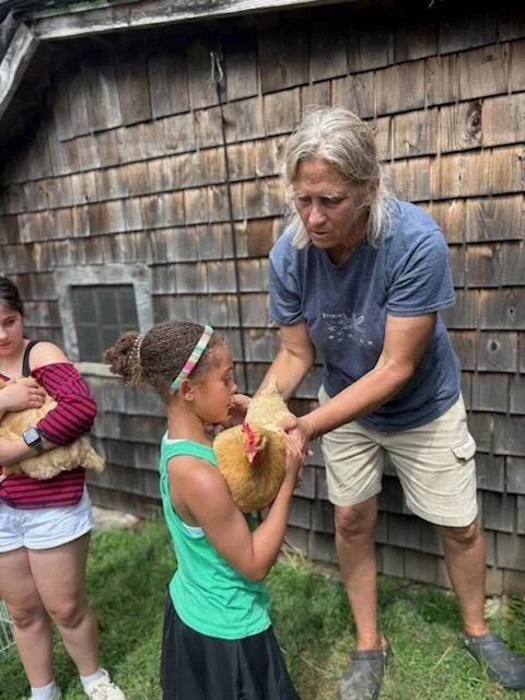 Farmer Jill shares how to care for chickens at Kids Farm Camp.